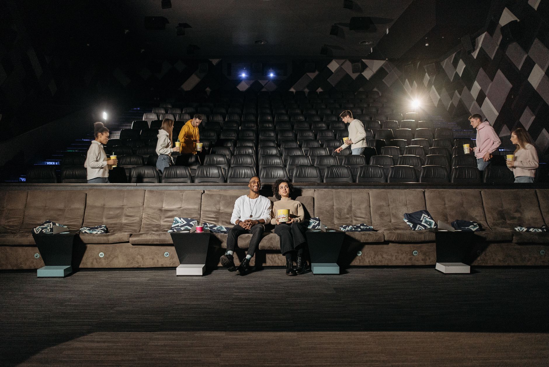 cinema theater hall dark seats with screen glow