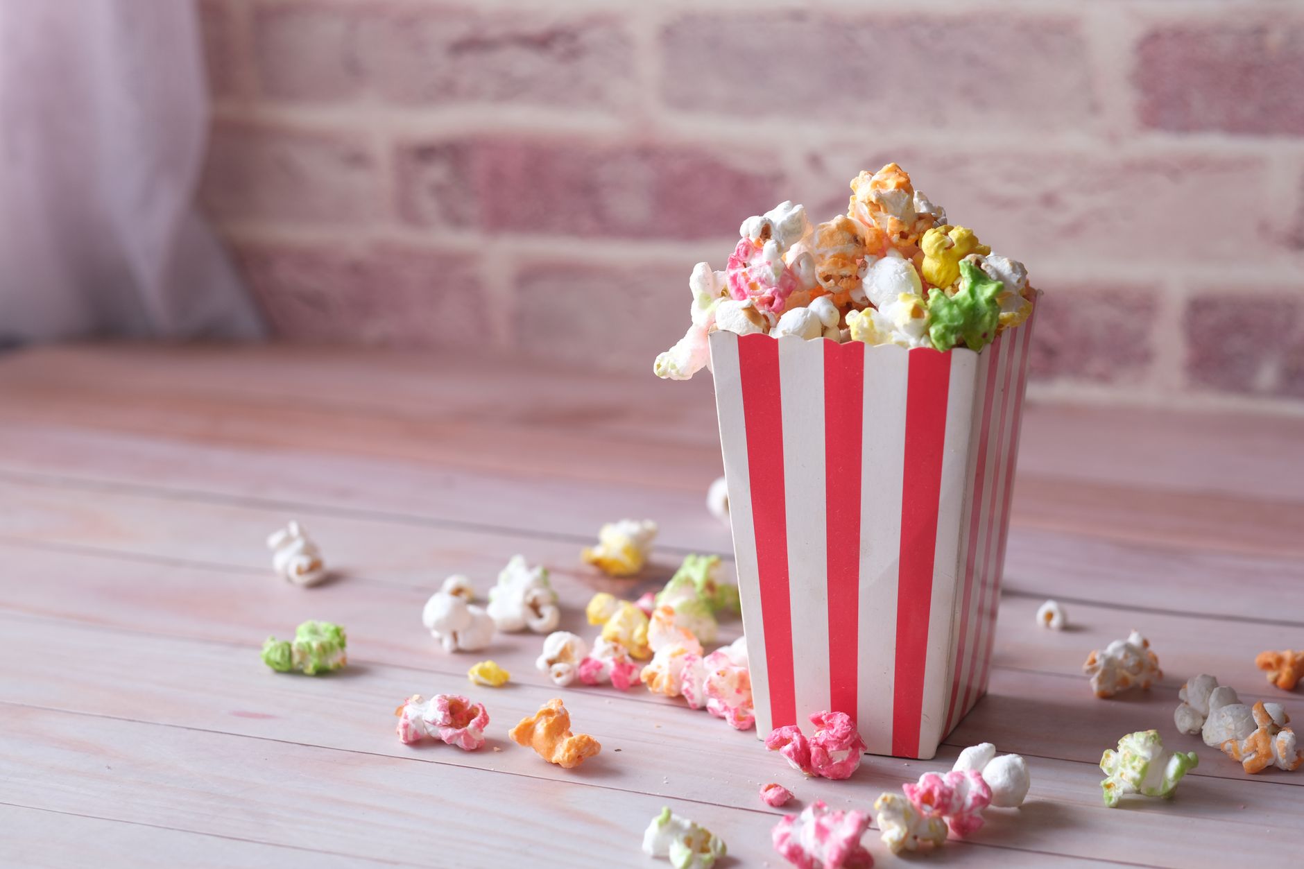 movie popcorn bucket neon lighting close-up