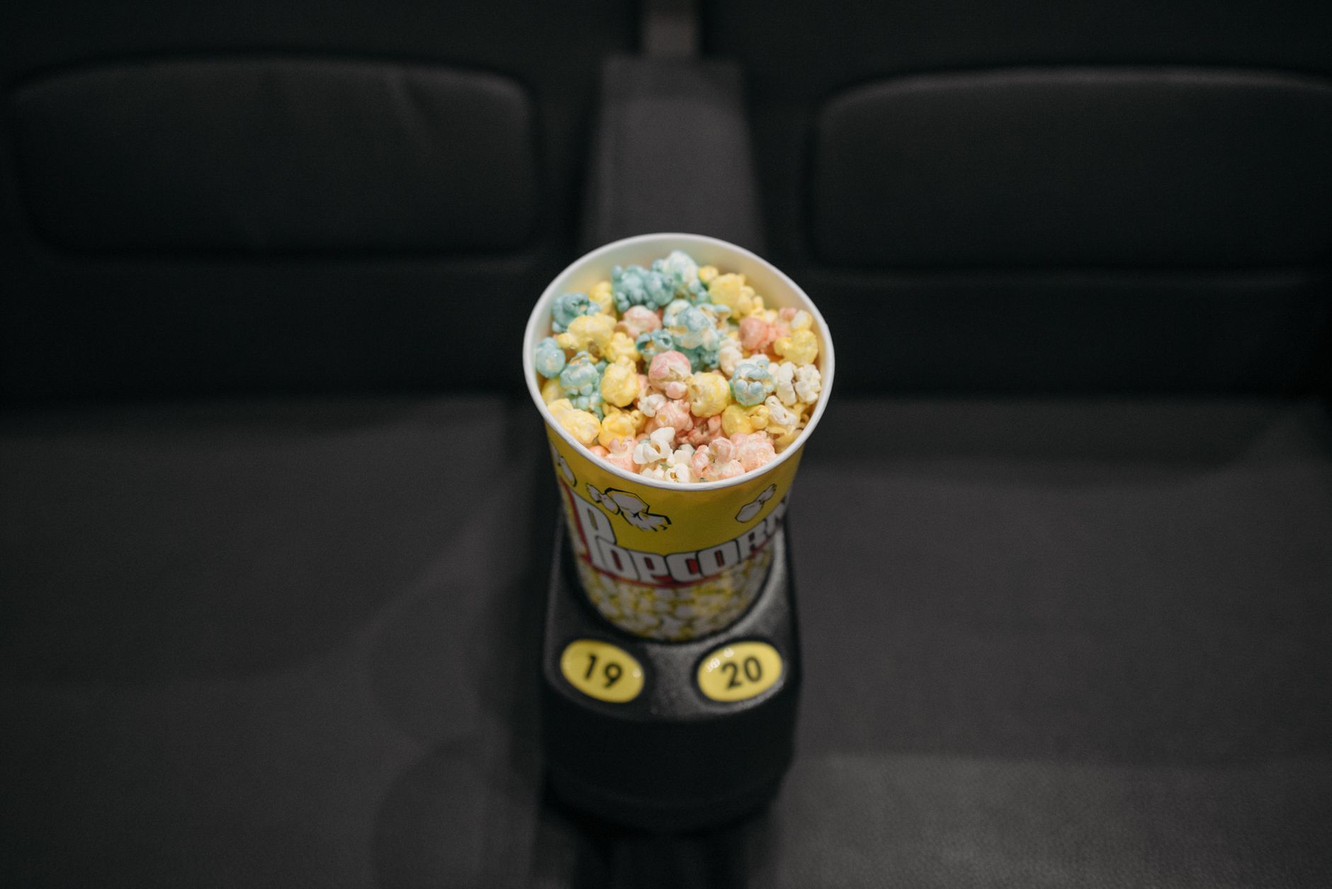 movie popcorn bucket neon lighting close-up