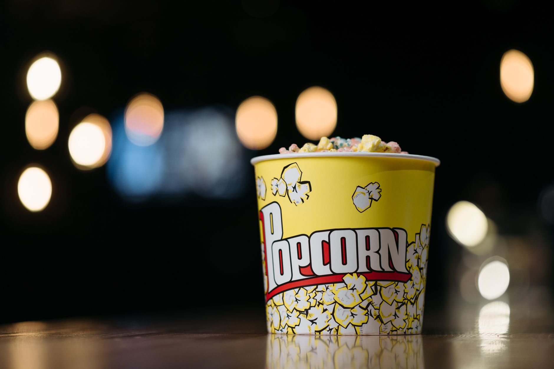 movie popcorn bucket neon lighting close-up