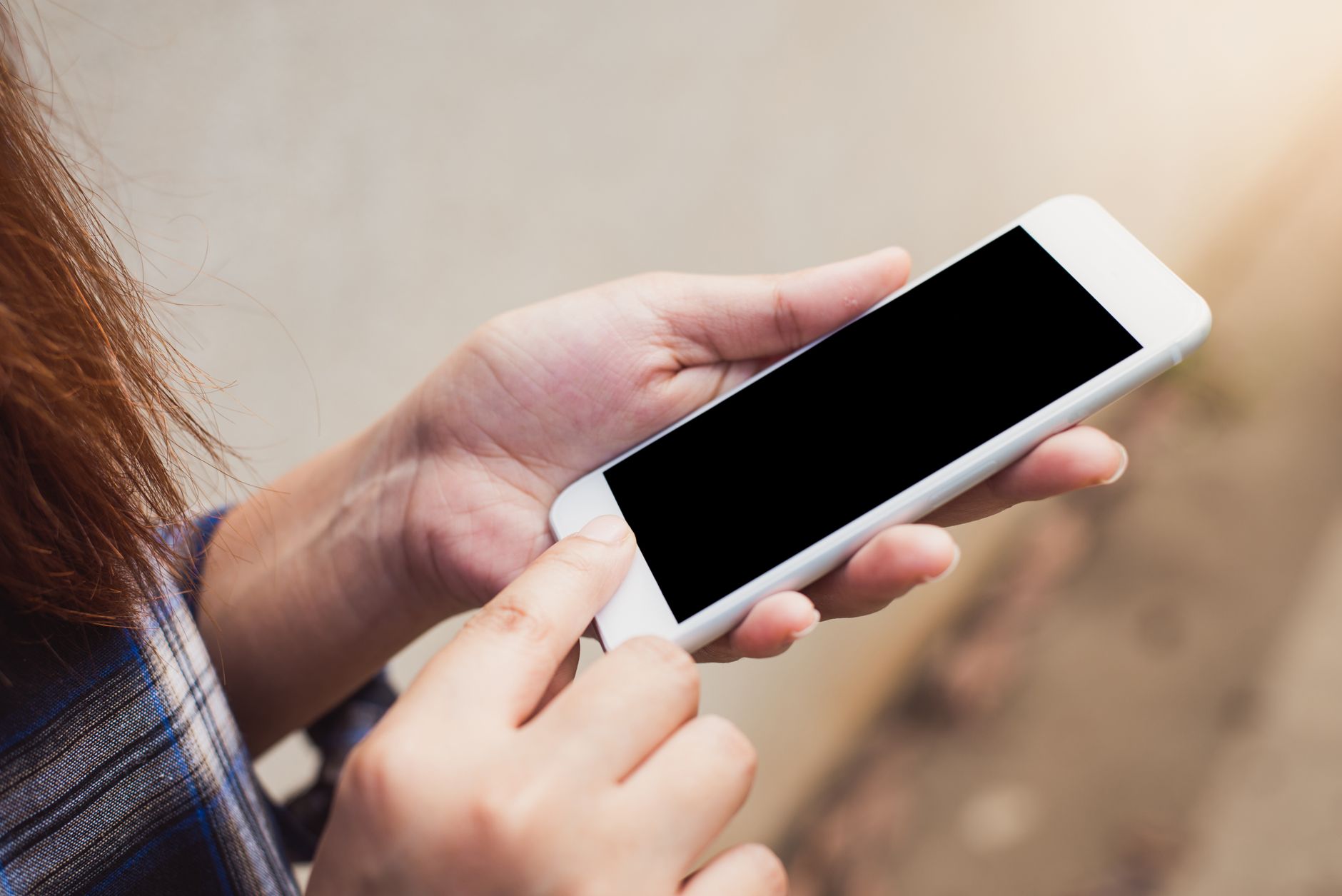 hands holding smartphone browsing website with network signal
