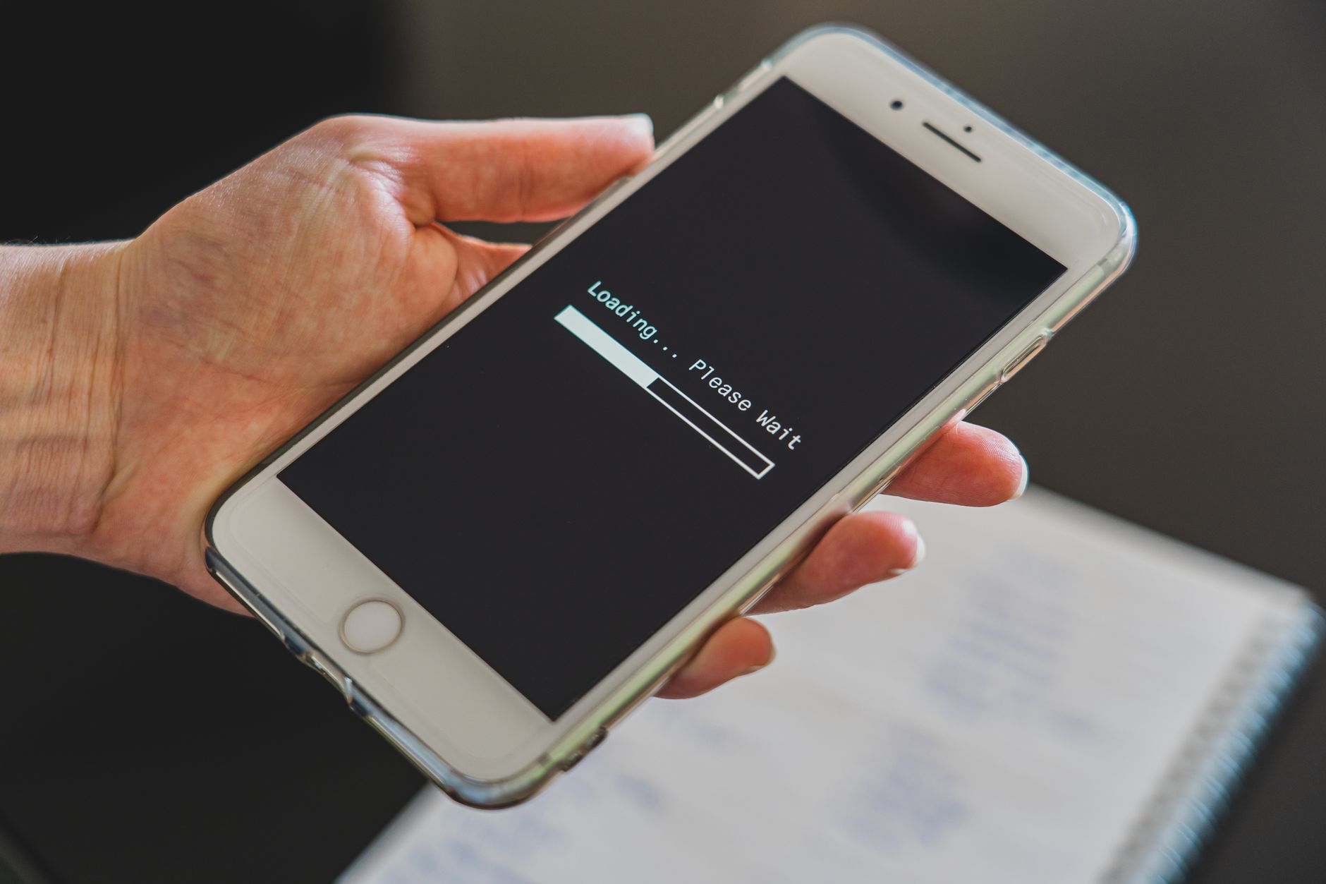 hands holding smartphone with 5G signal icon