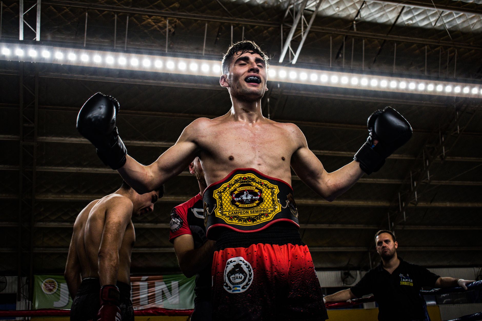 Alex Pereira celebrating victory in octagon arena