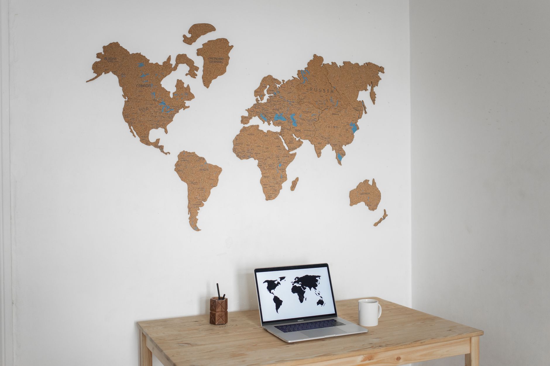 world map on screen with Riyadh news headlines