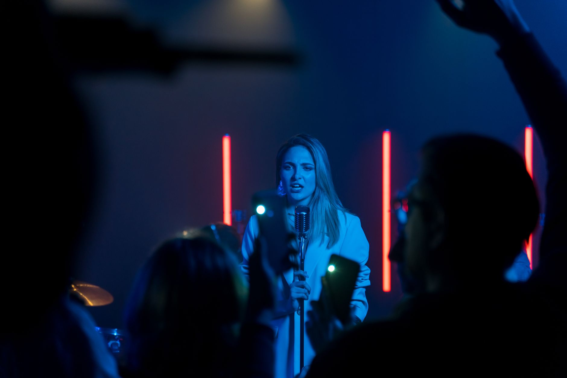 pop star singing on grand concert stage
