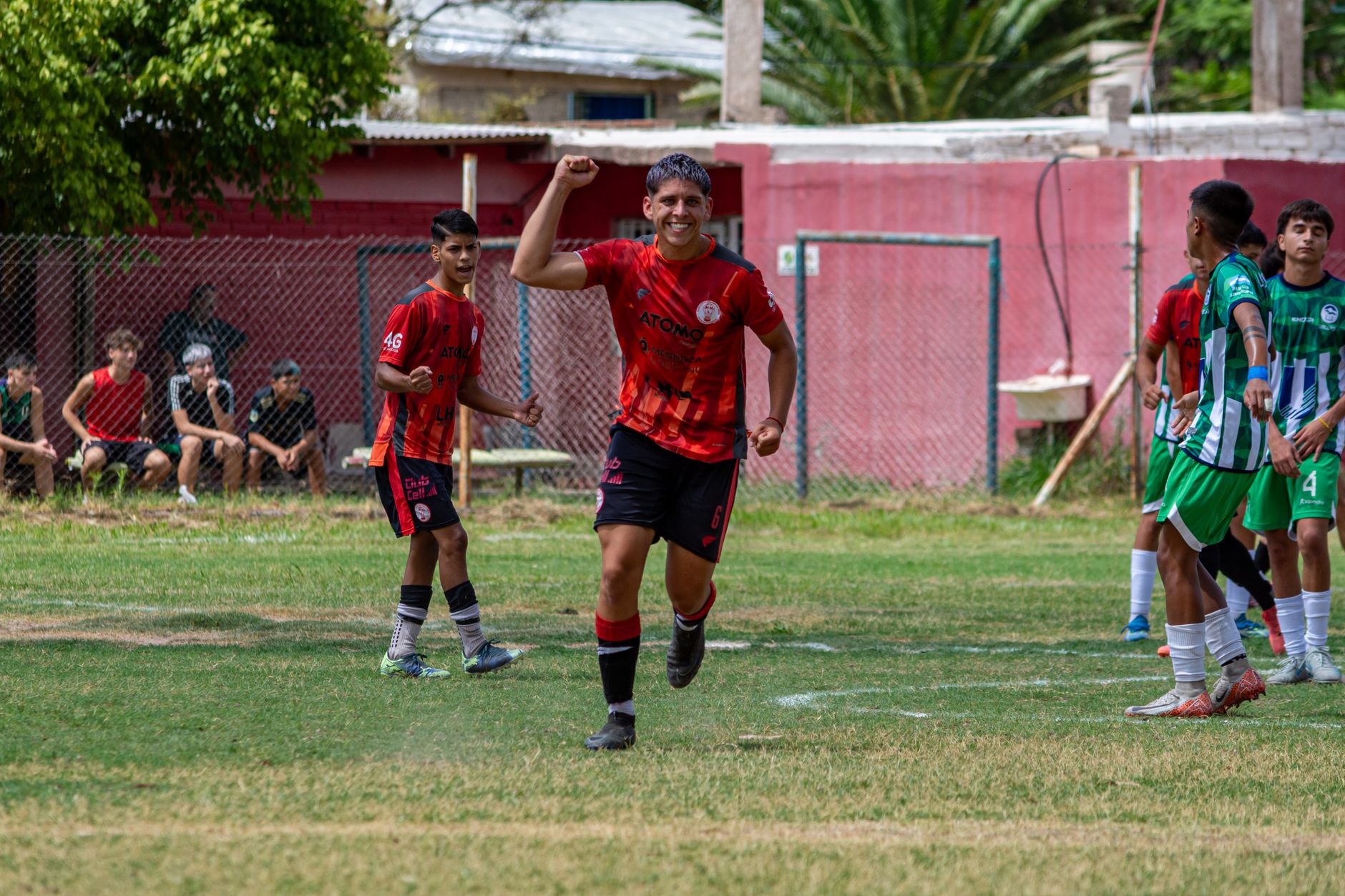 football player celebrating goal on field