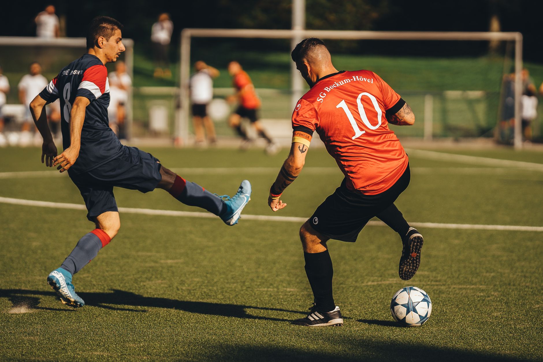 football players competing for ball on field