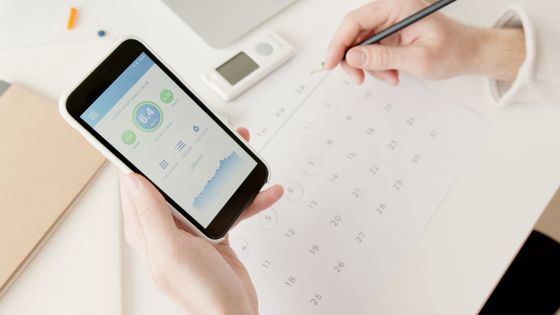 hand holding smartphone checking electricity meter display