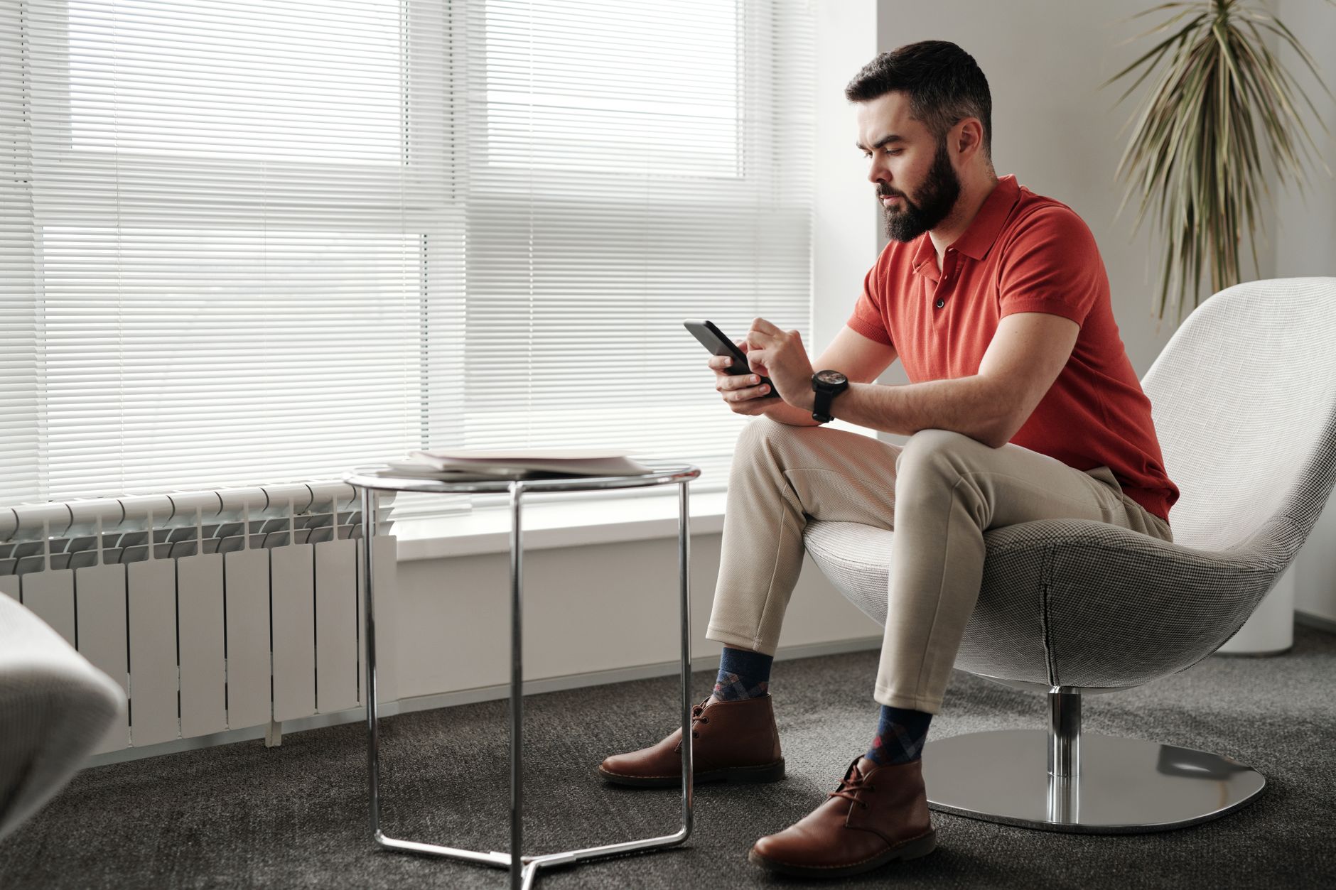 person checking smartphone signal strength at home