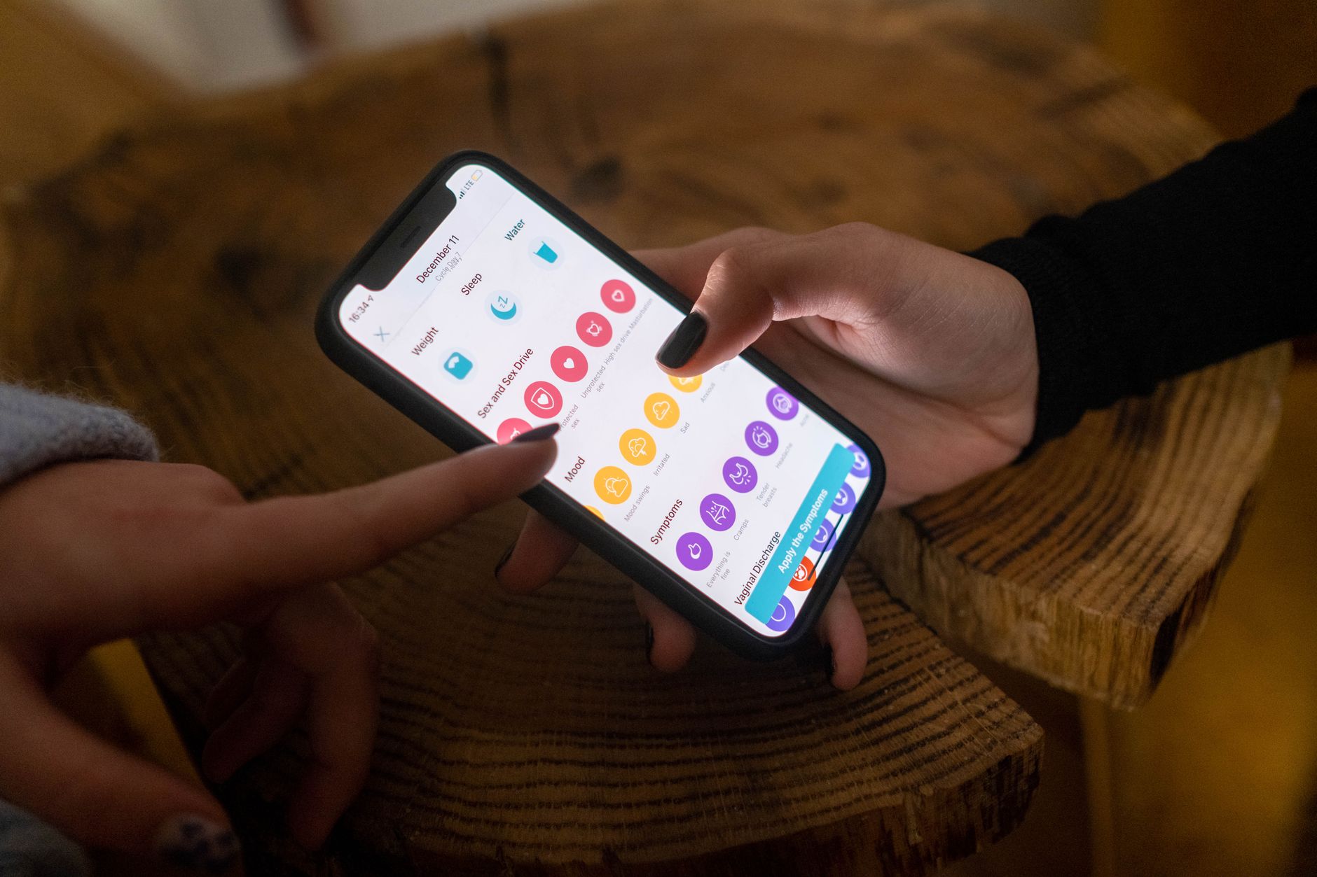 person holding smartphone checking electricity bill application