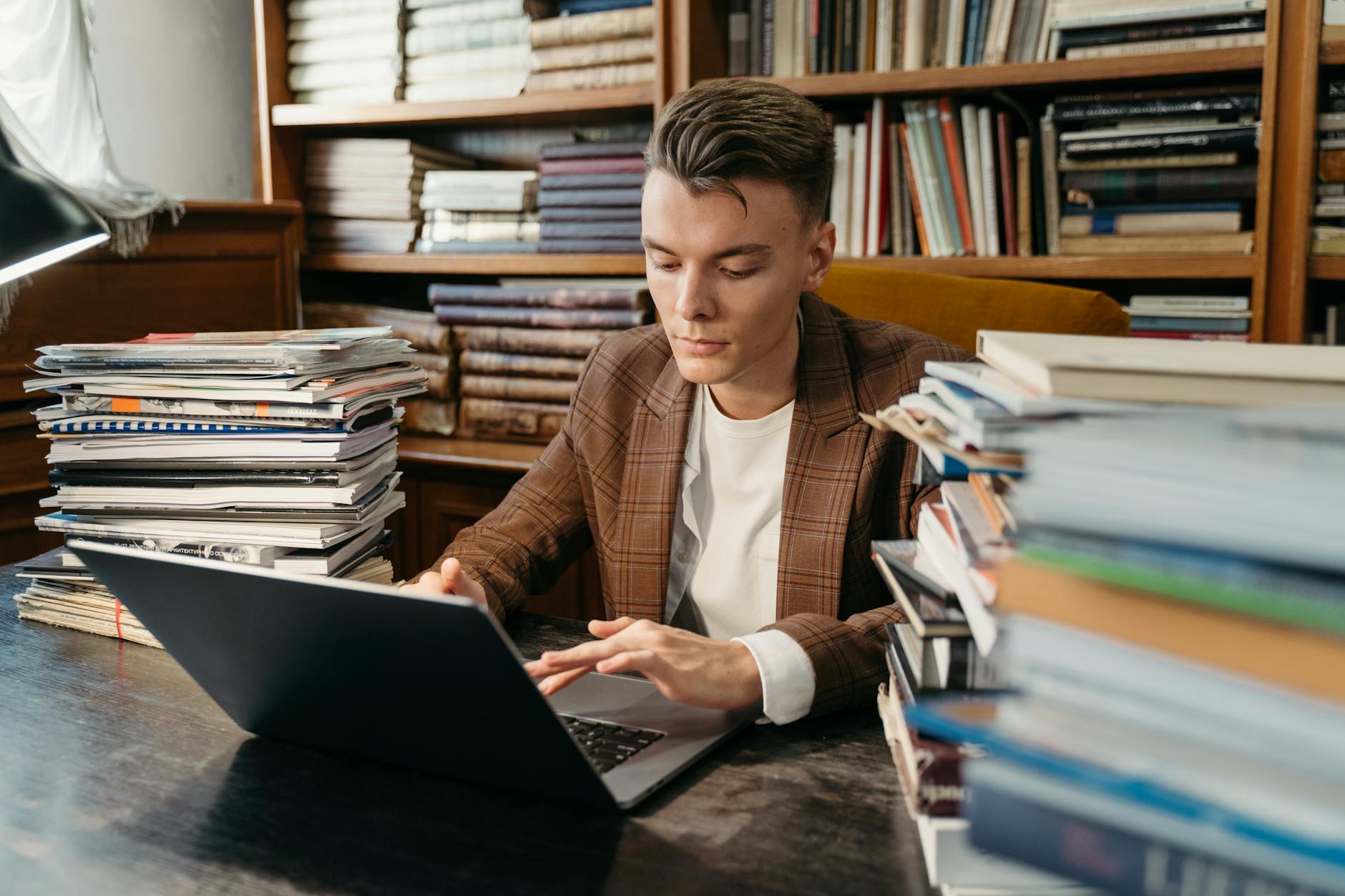 student checking laptop for scholarship status