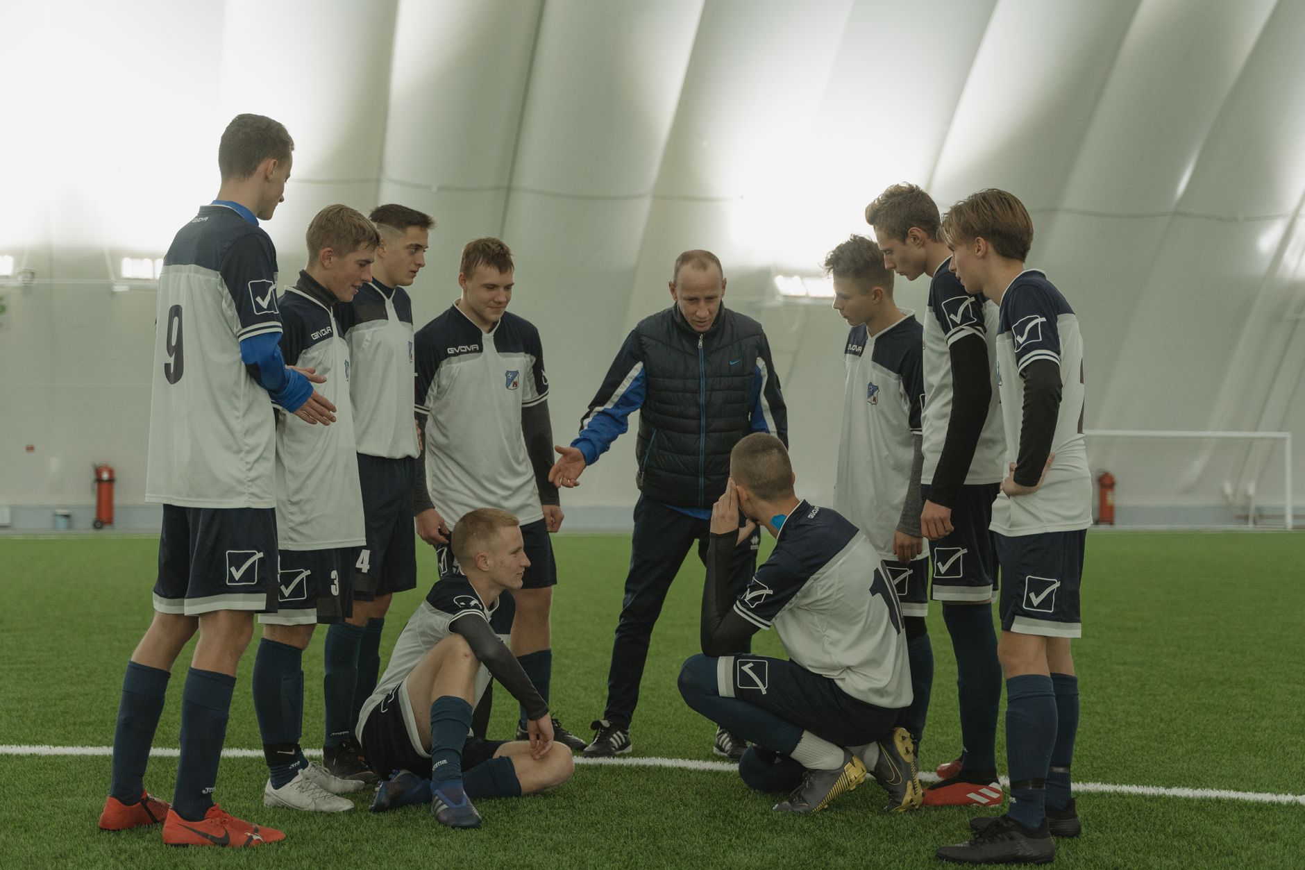 football coach giving instructions sidelines during match