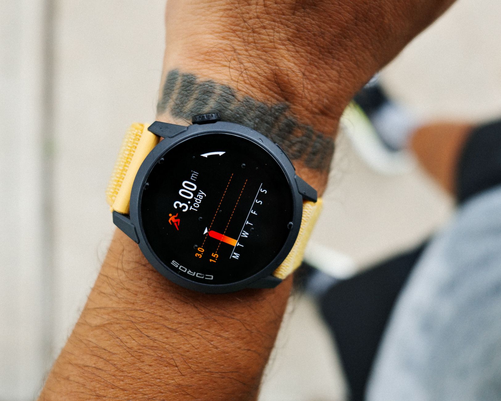 runner checking smartwatch on track