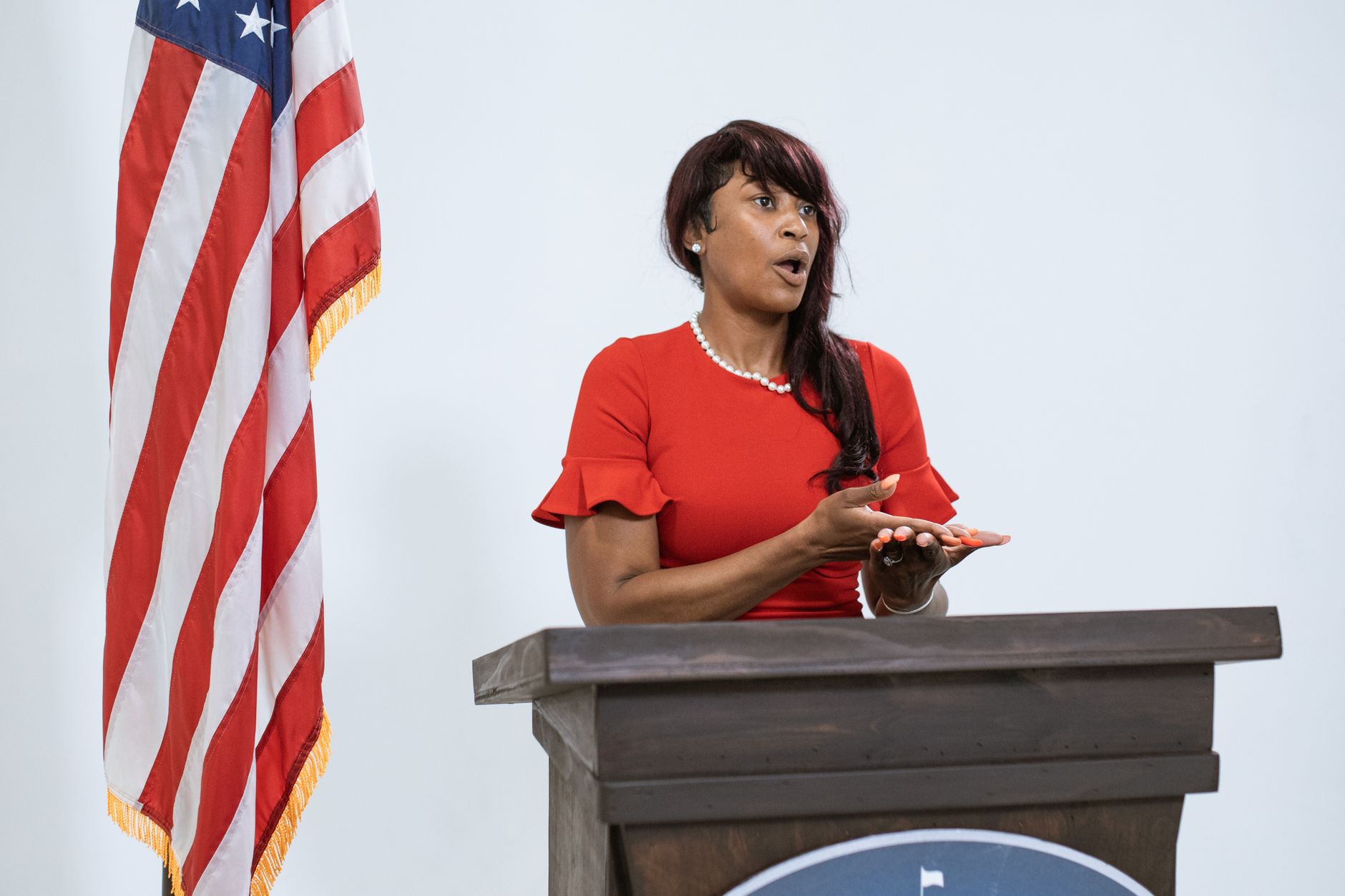government official speaking at podium microphone