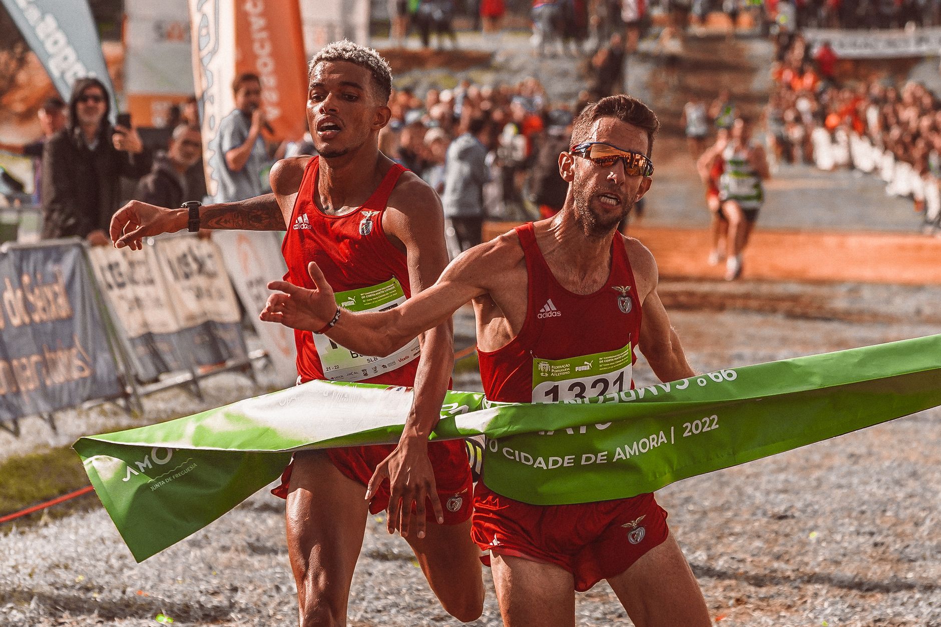runners crossing finish line marathon event
