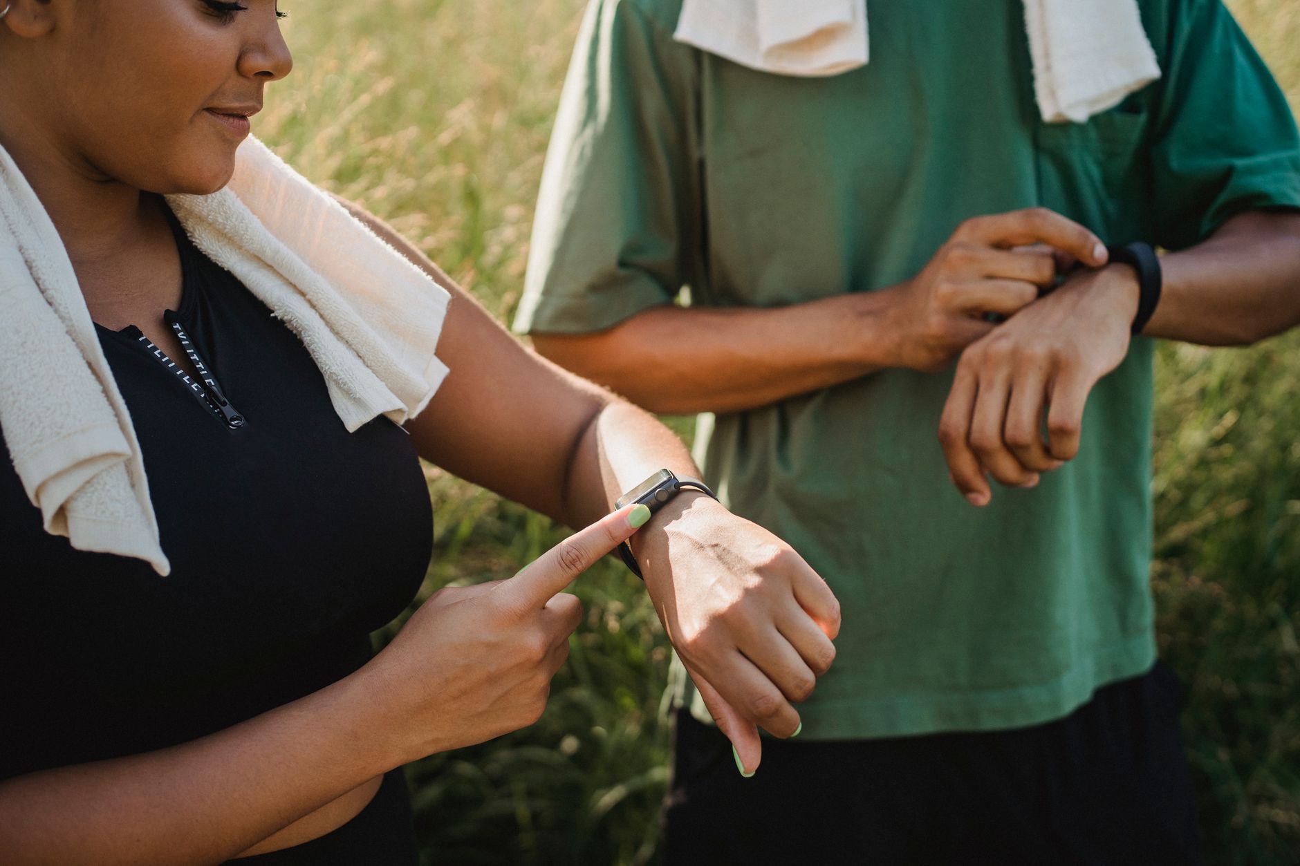 runner checking smartwatch during morning jog