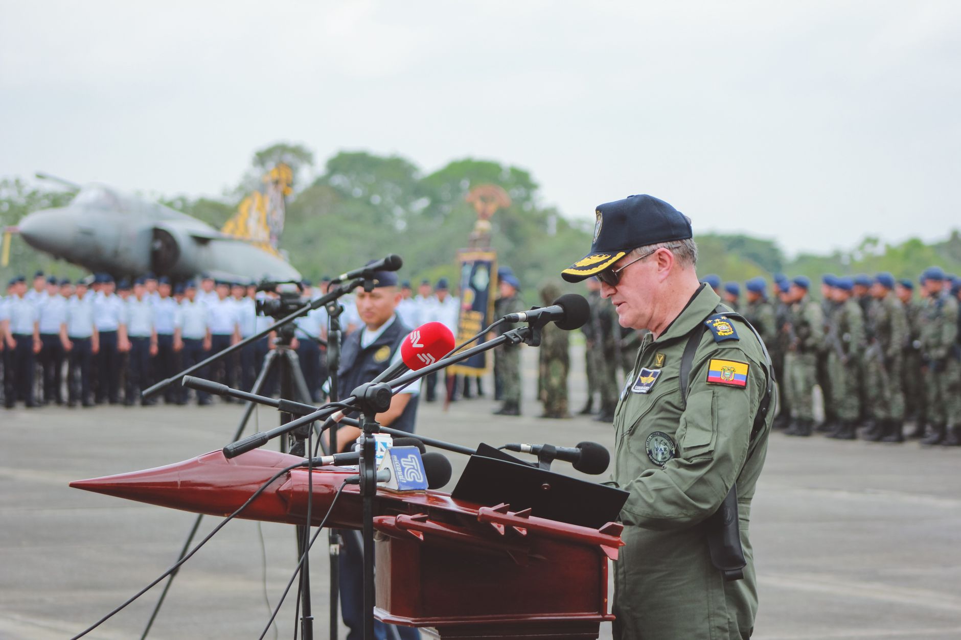 government official speaking at podium microphone
