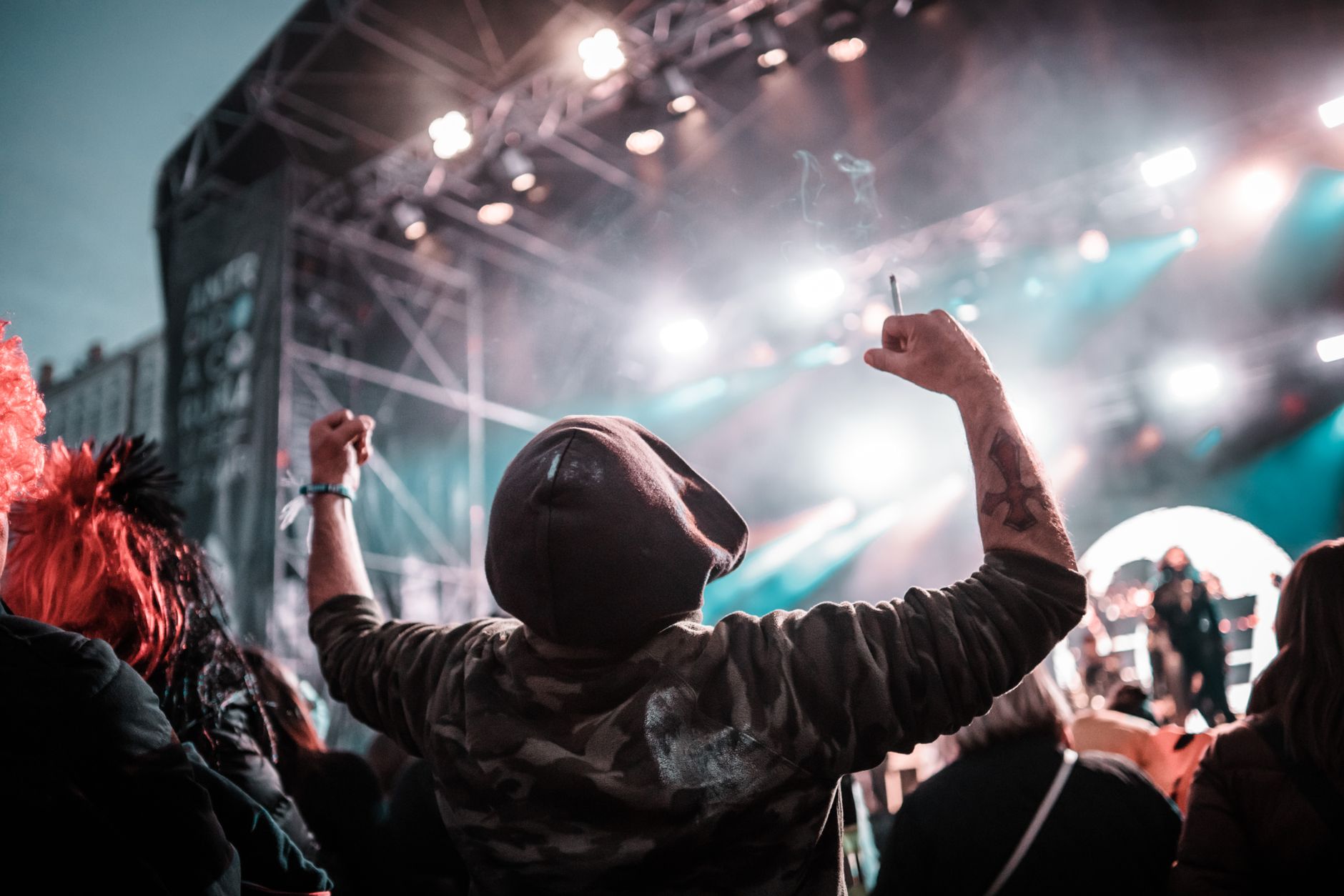 Music fans cheering at concert