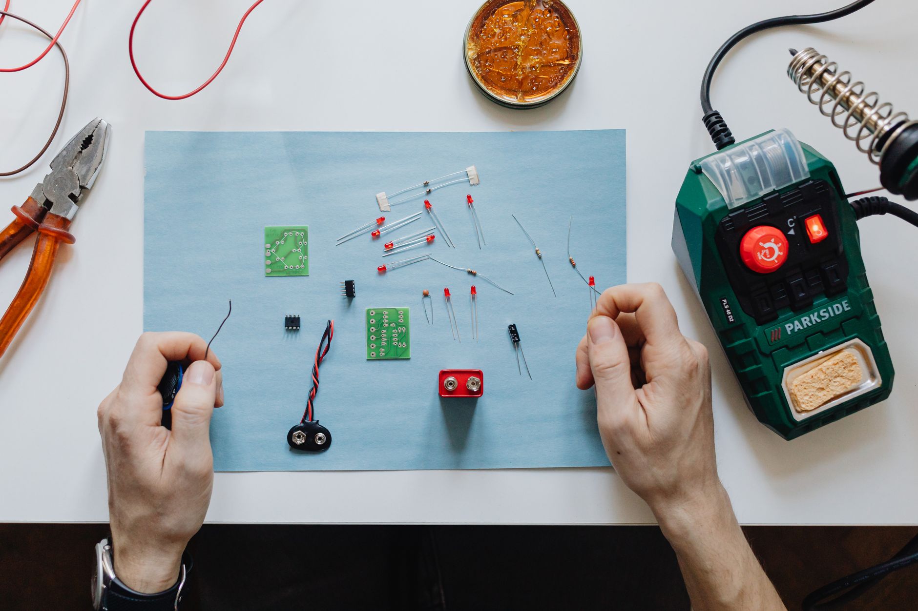 electrician hands connecting wires in fuse box