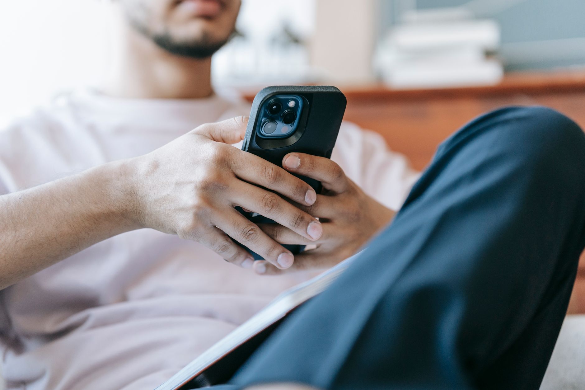 person holding smartphone watching live draw