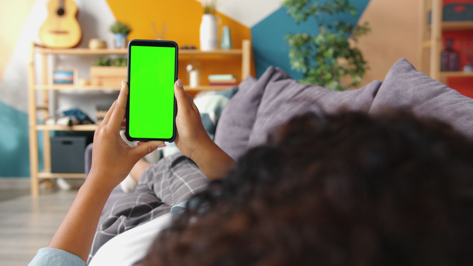 person watching live draw on smartphone screen