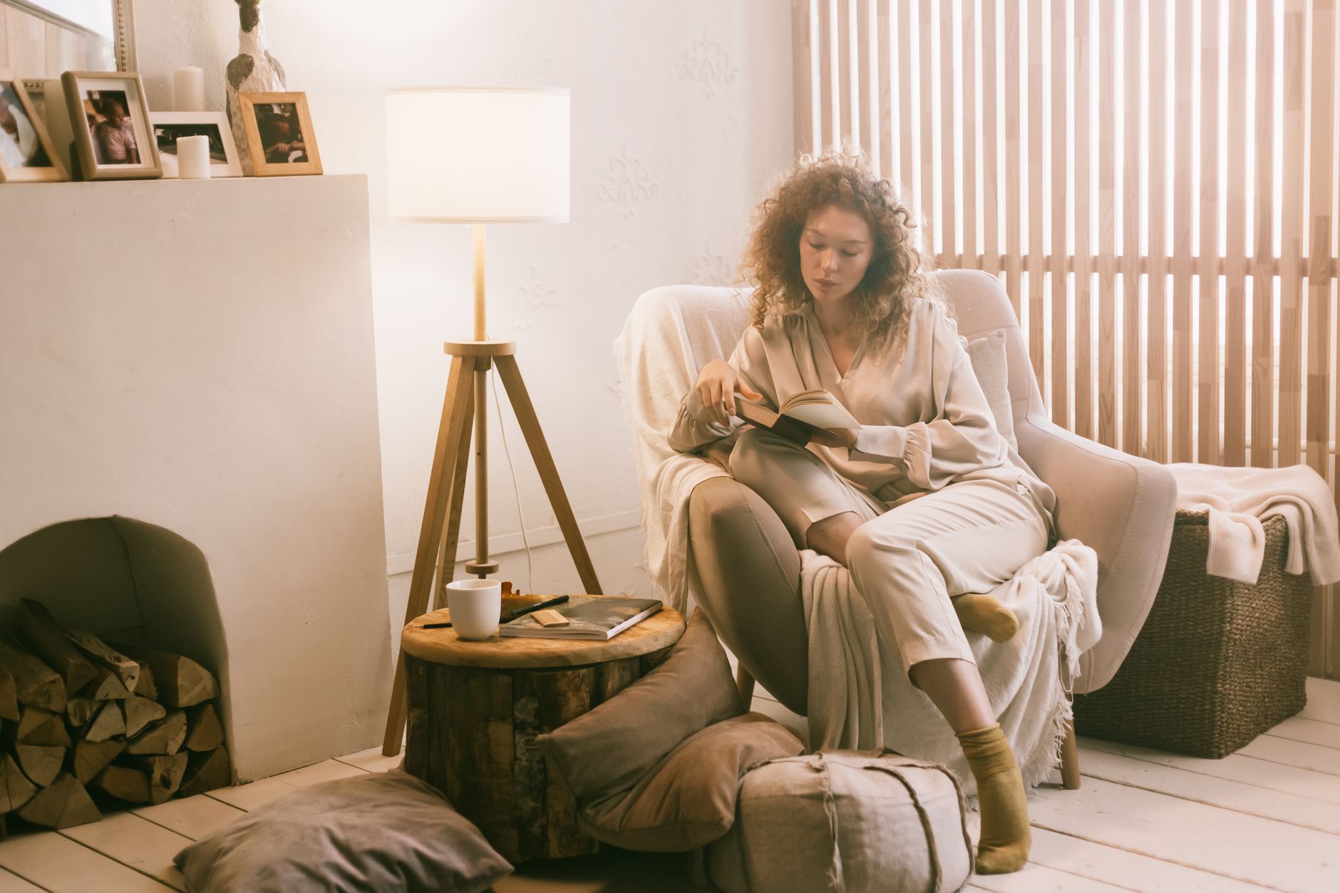 Woman turning off lights in living room