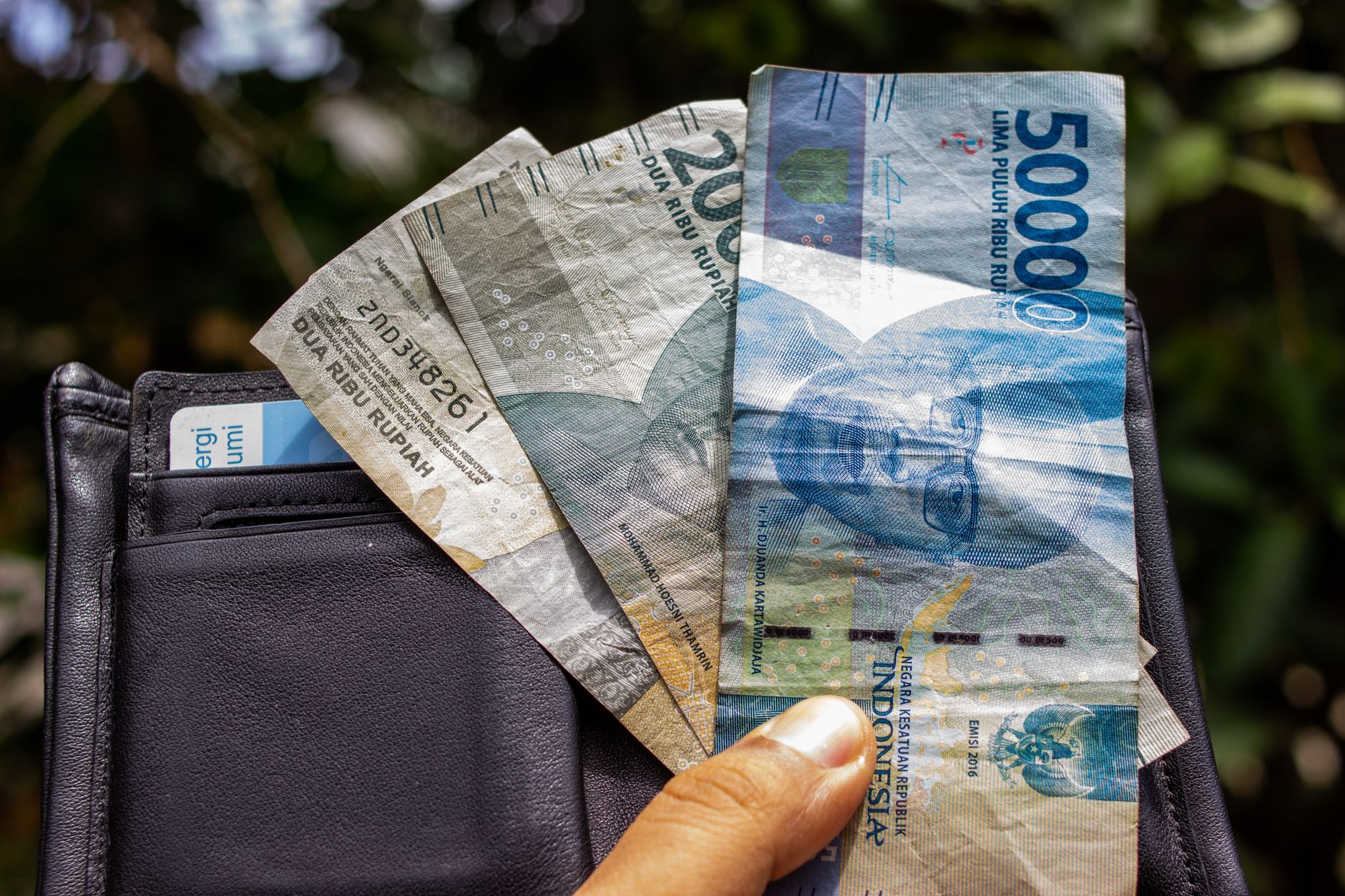 rupiah banknotes spread on office desk