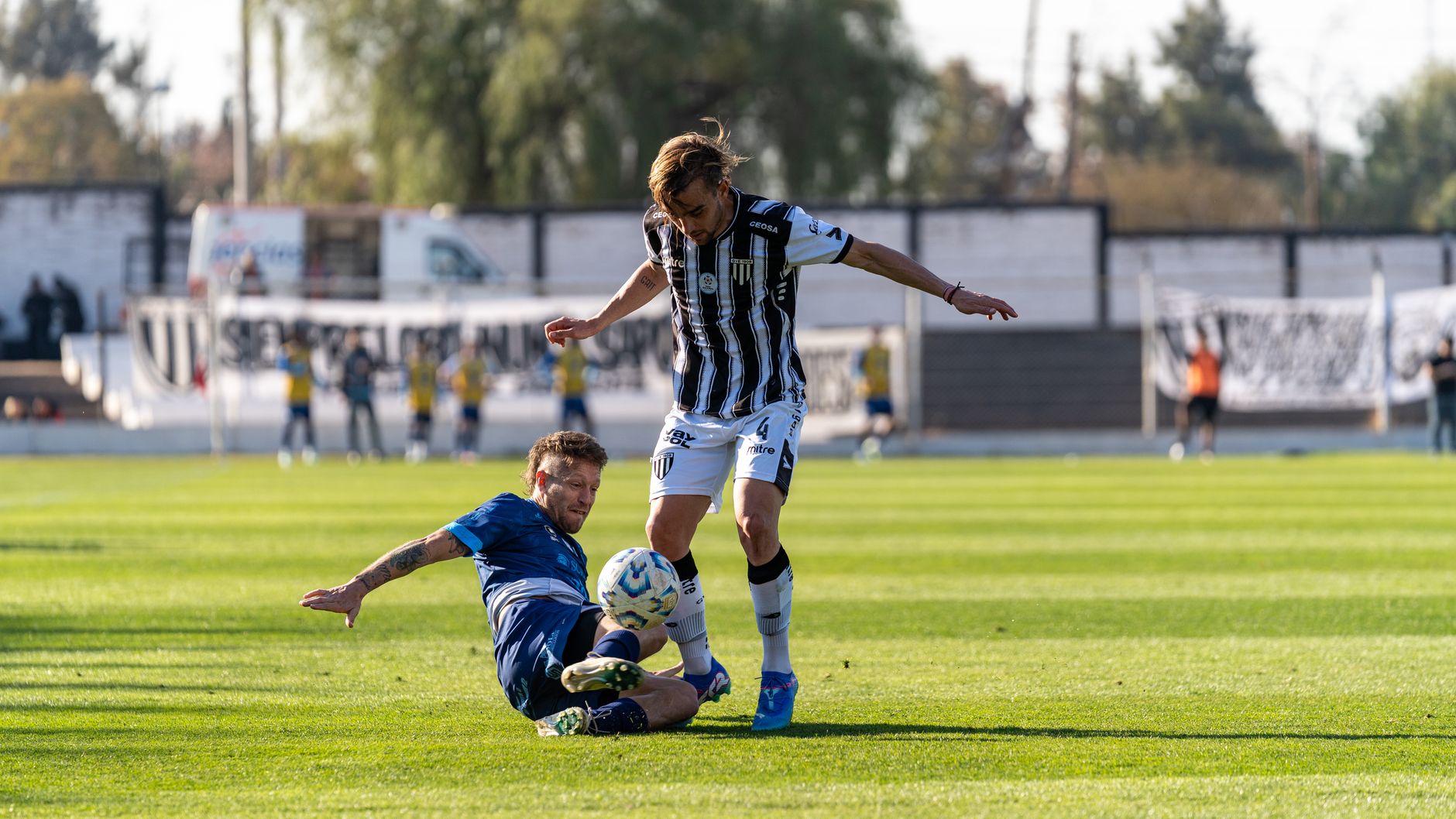 football players in intense tackle during match