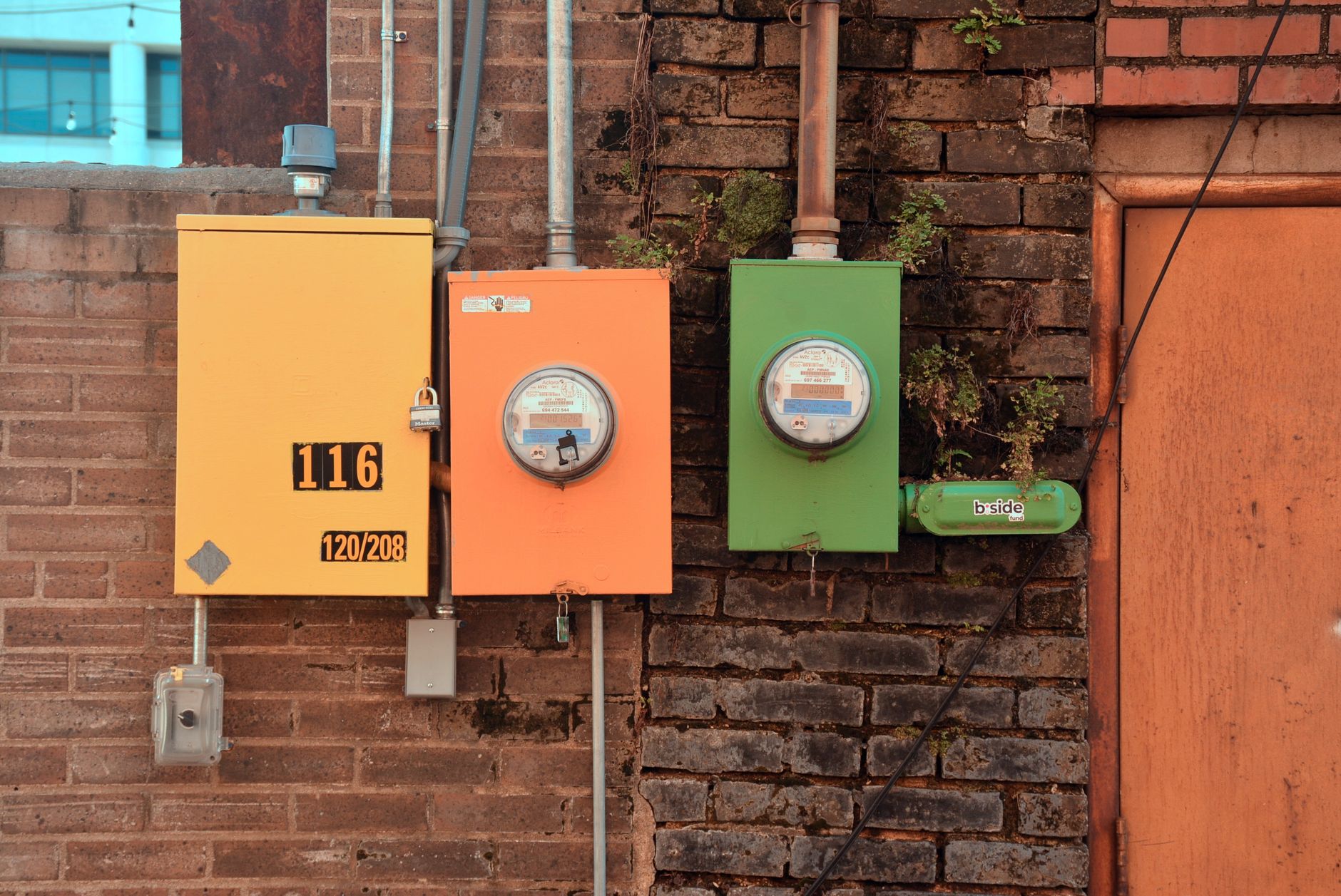 person's hand entering token on electricity meter