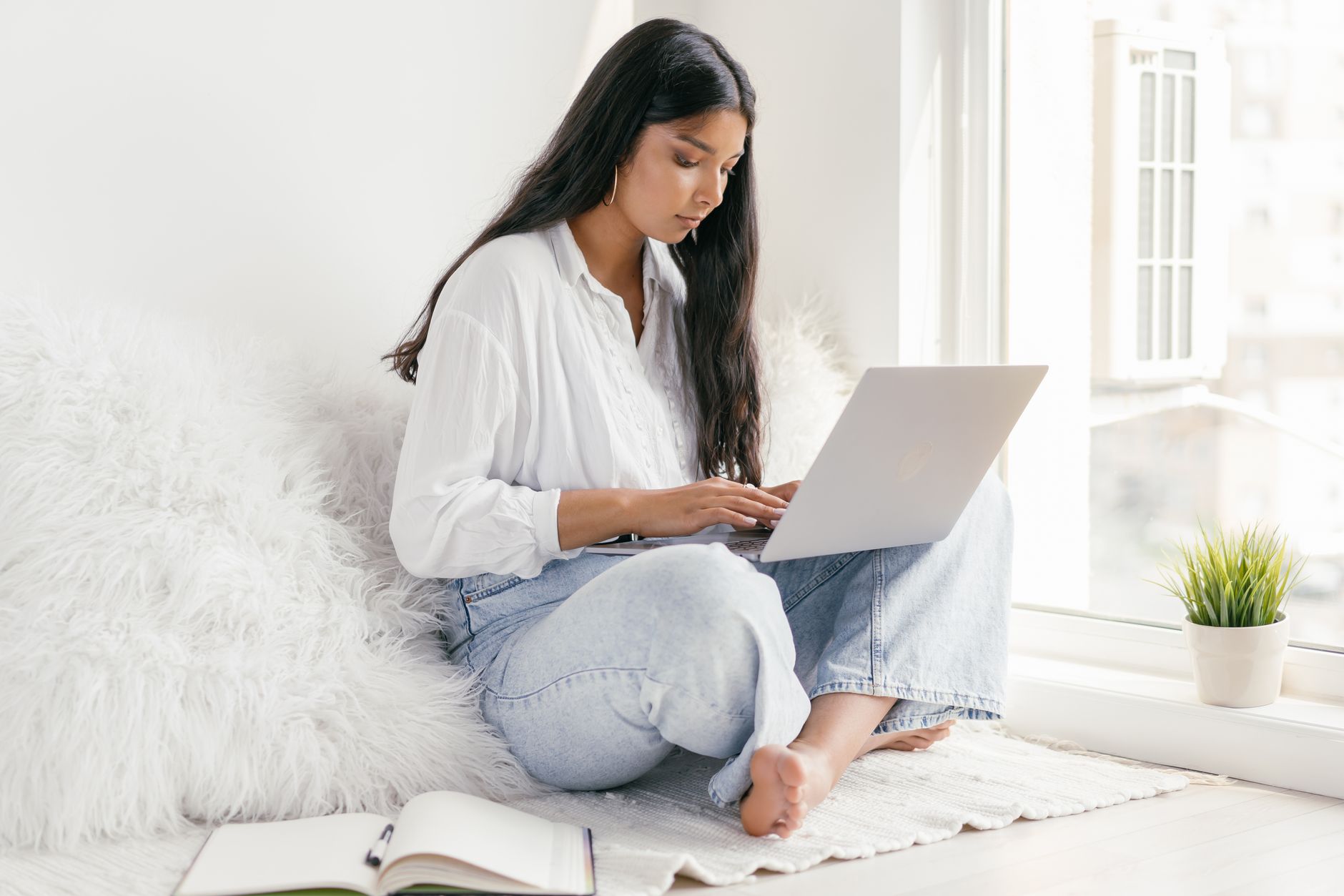 student filling out online application form laptop