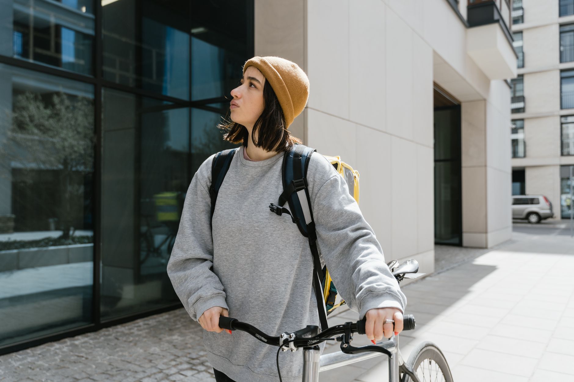 motorcycle courier delivering package city street