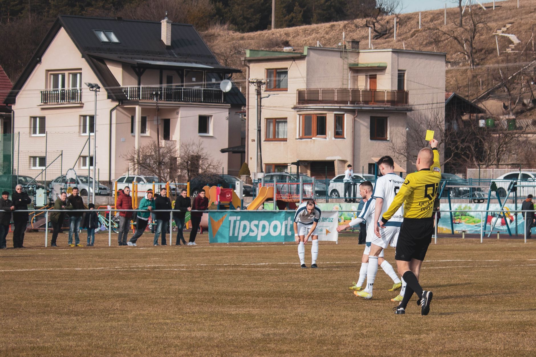 football referee watching play closely