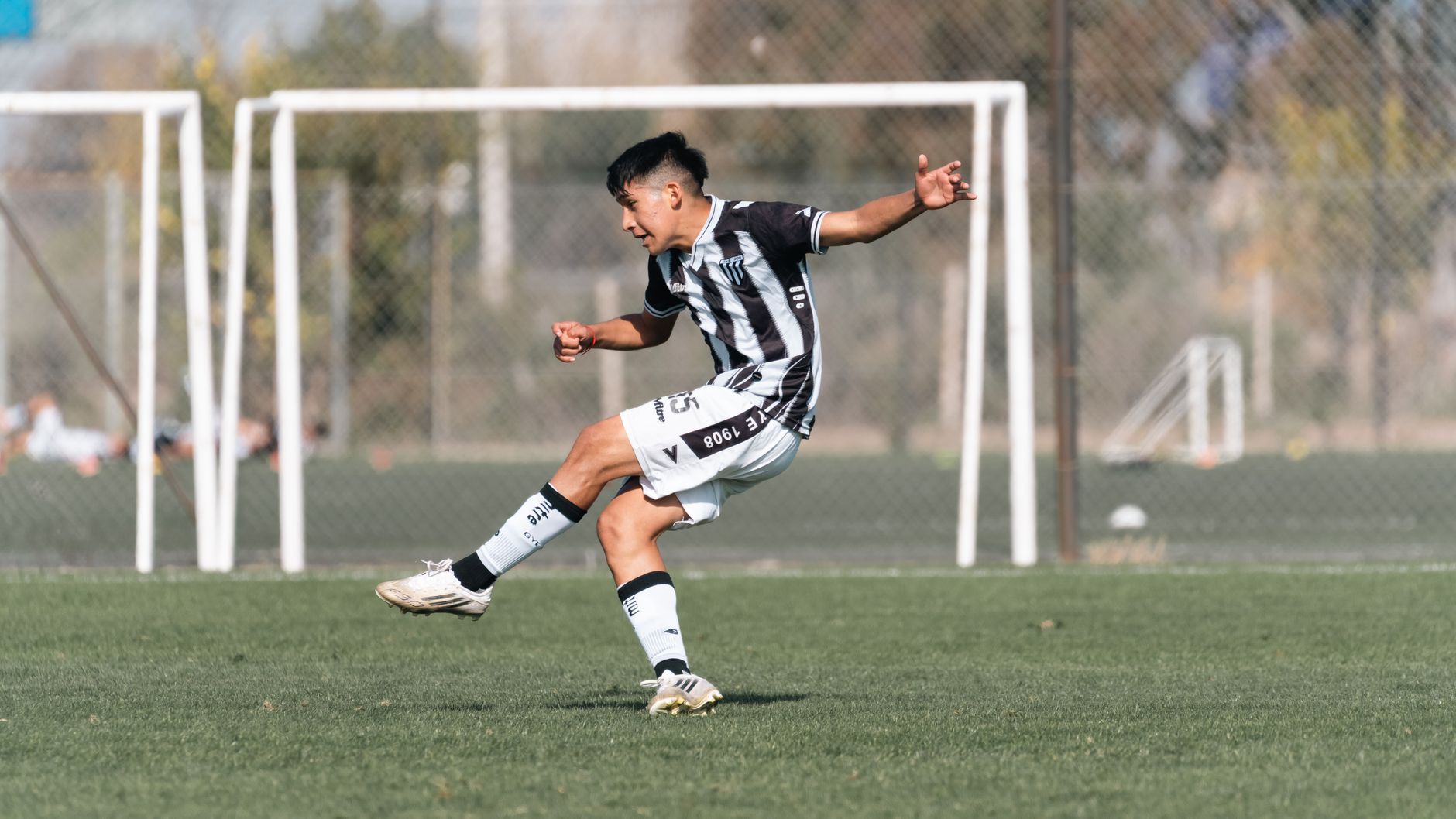 Mexican footballer striker celebrating goal