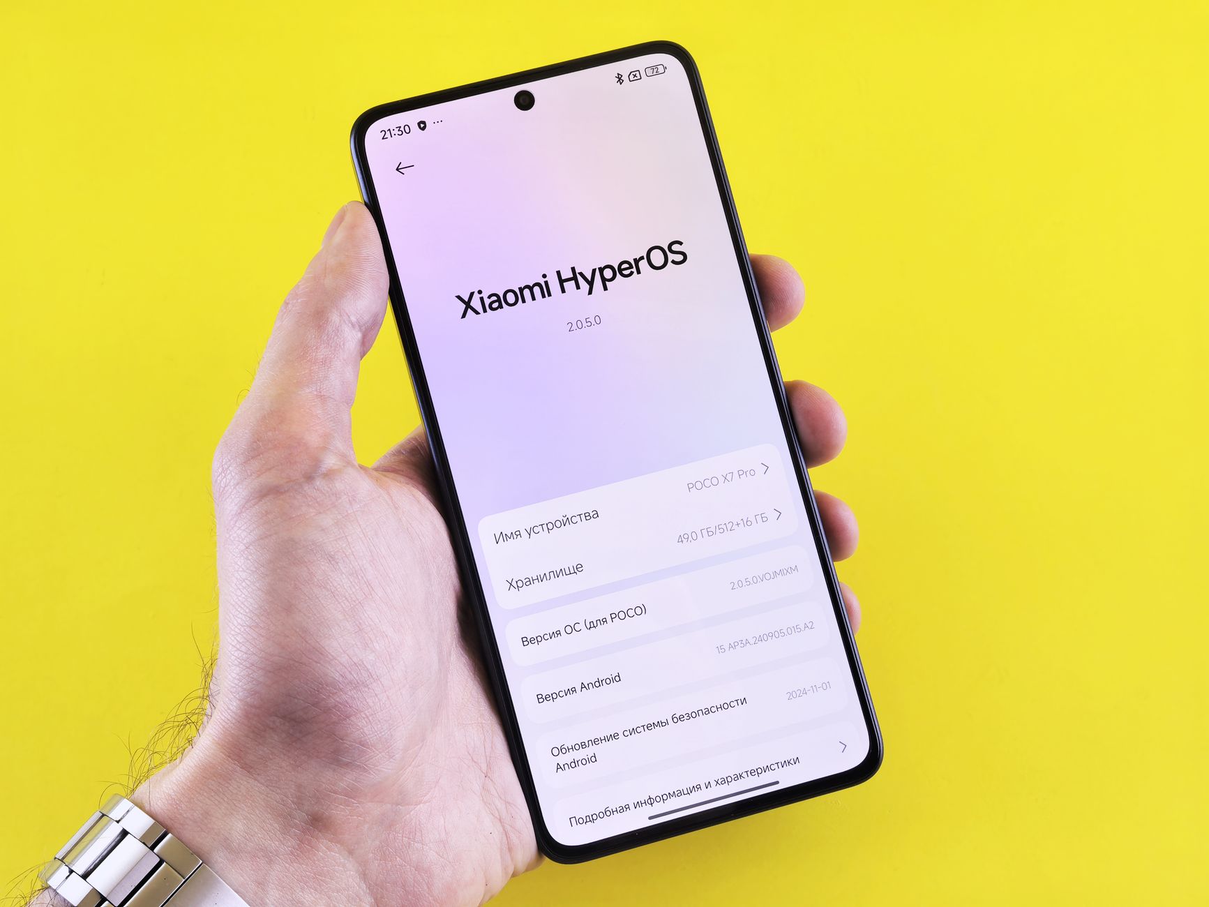 hand holding android phone with bright screen charging