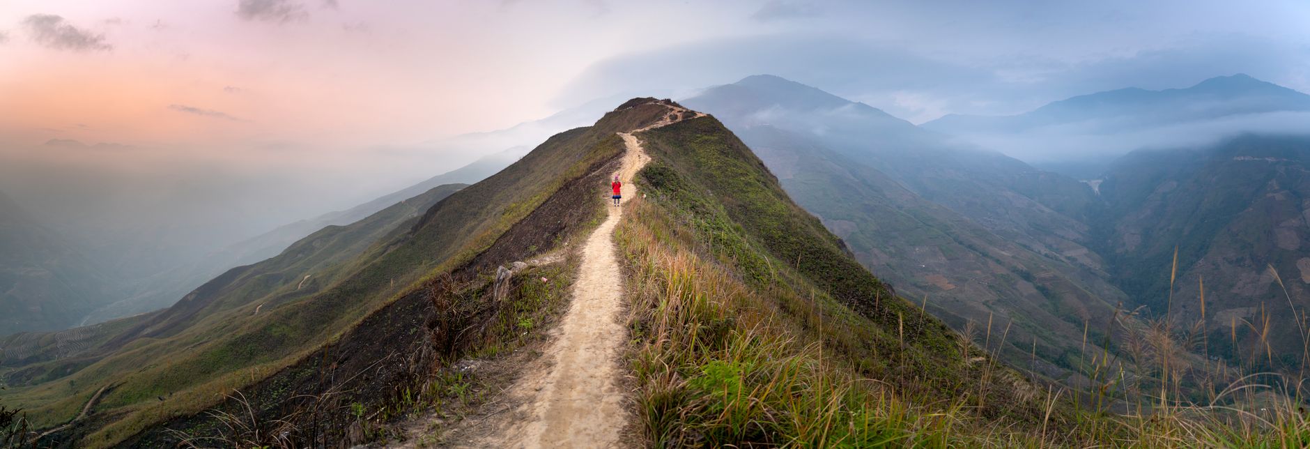 trail runner ascending mountain path sunrise