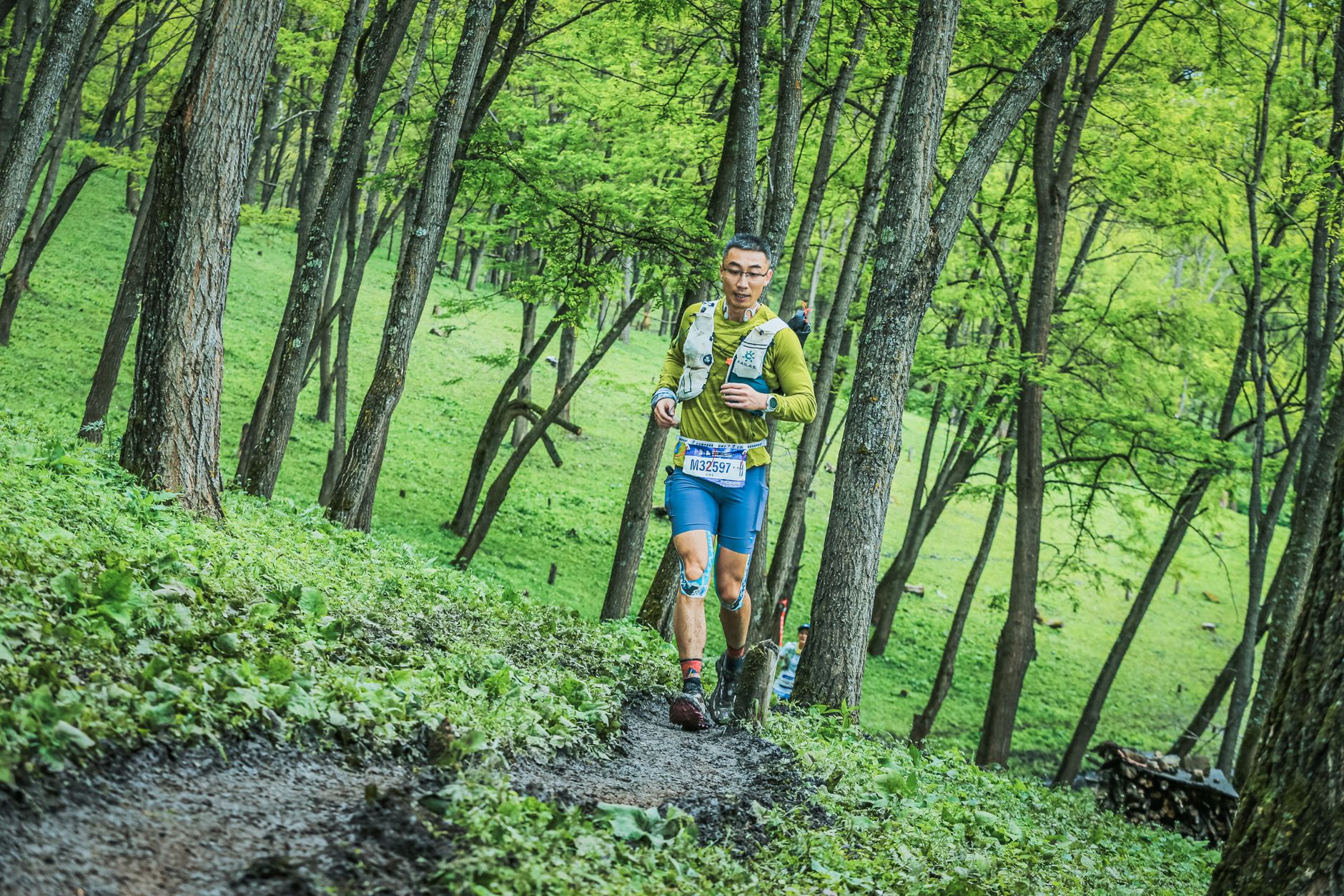 athlete trail running steep mountain path