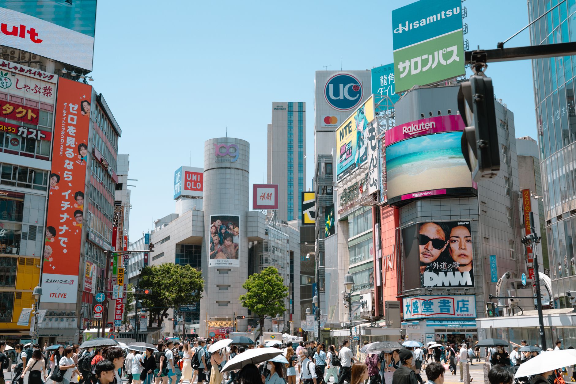 crowd looking at large public digital billboard