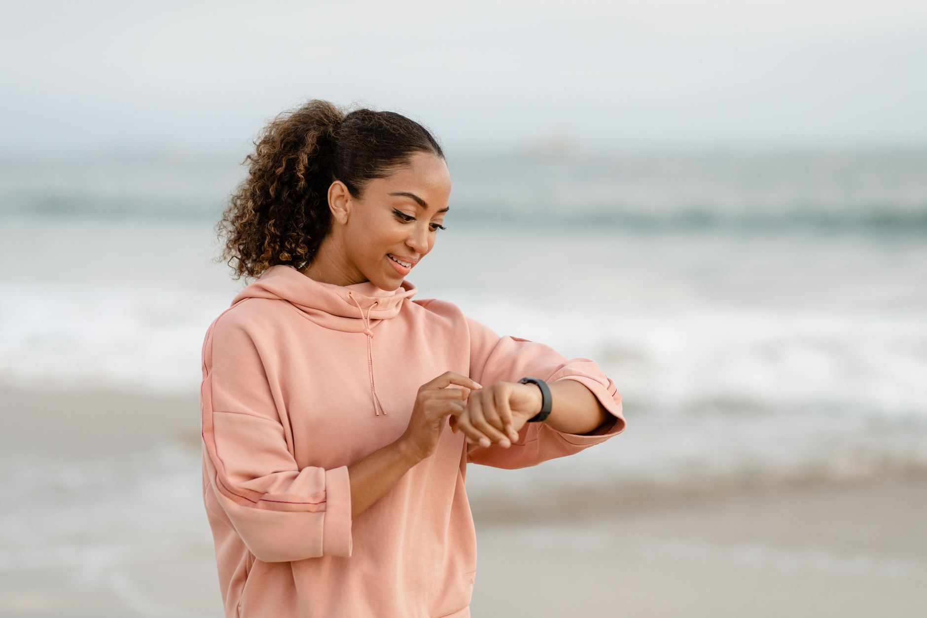 person jogging in green park early morning wearing smartwatch