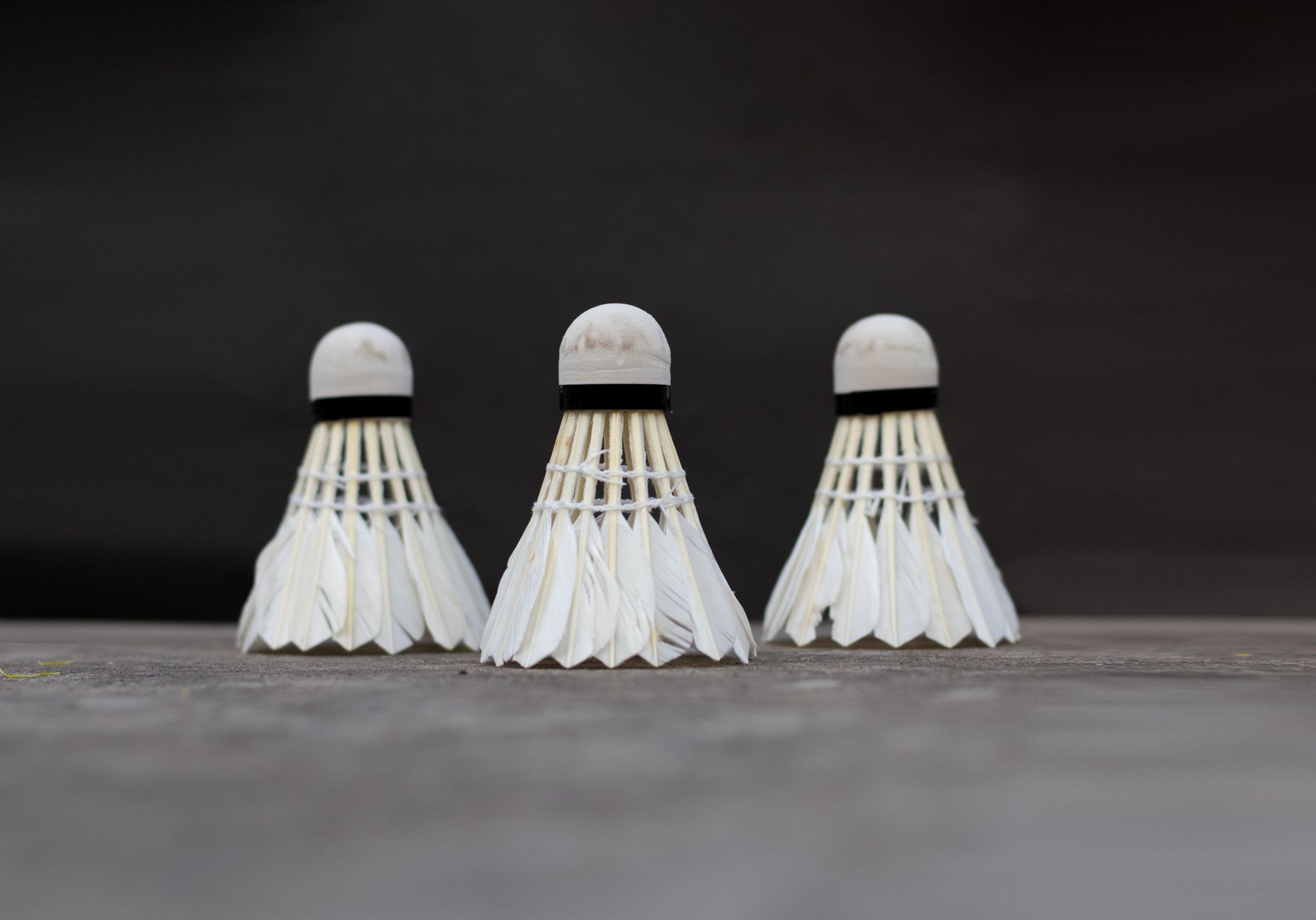 badminton player hitting shuttlecock during match