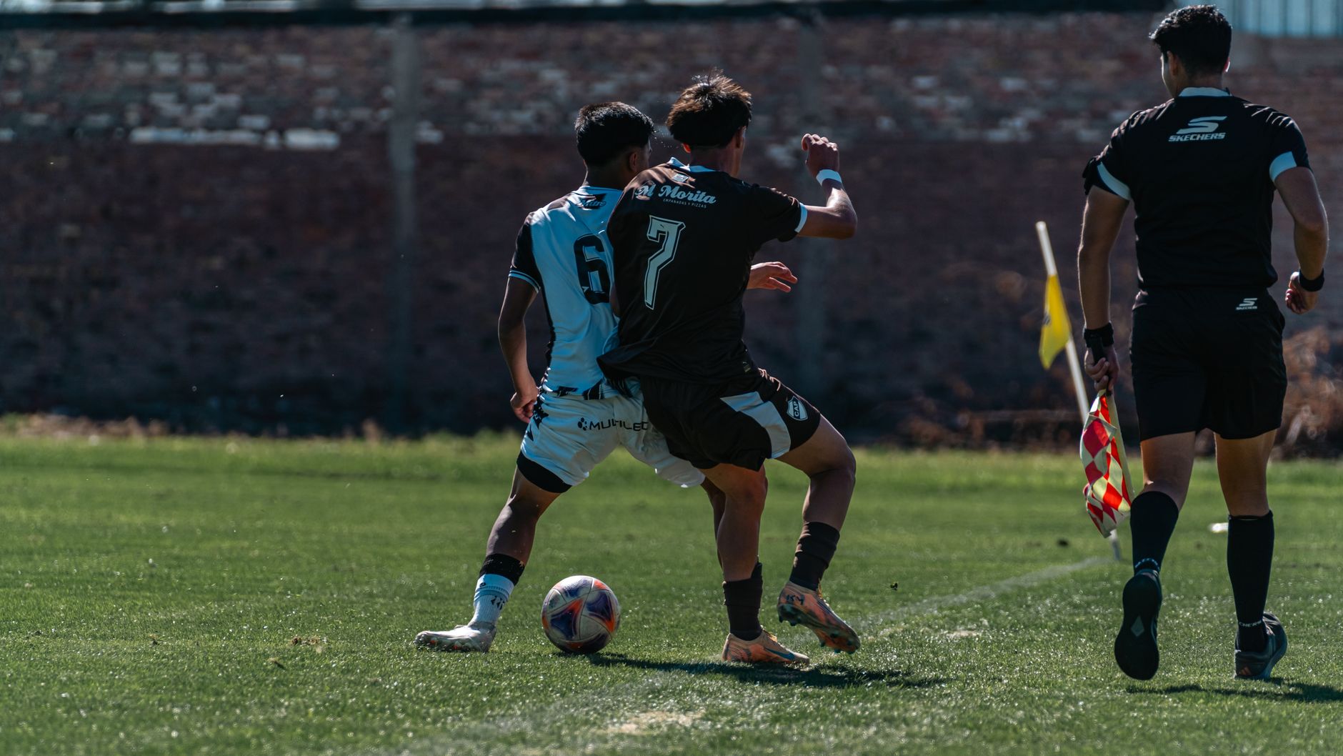 American soccer player defending ball during match
