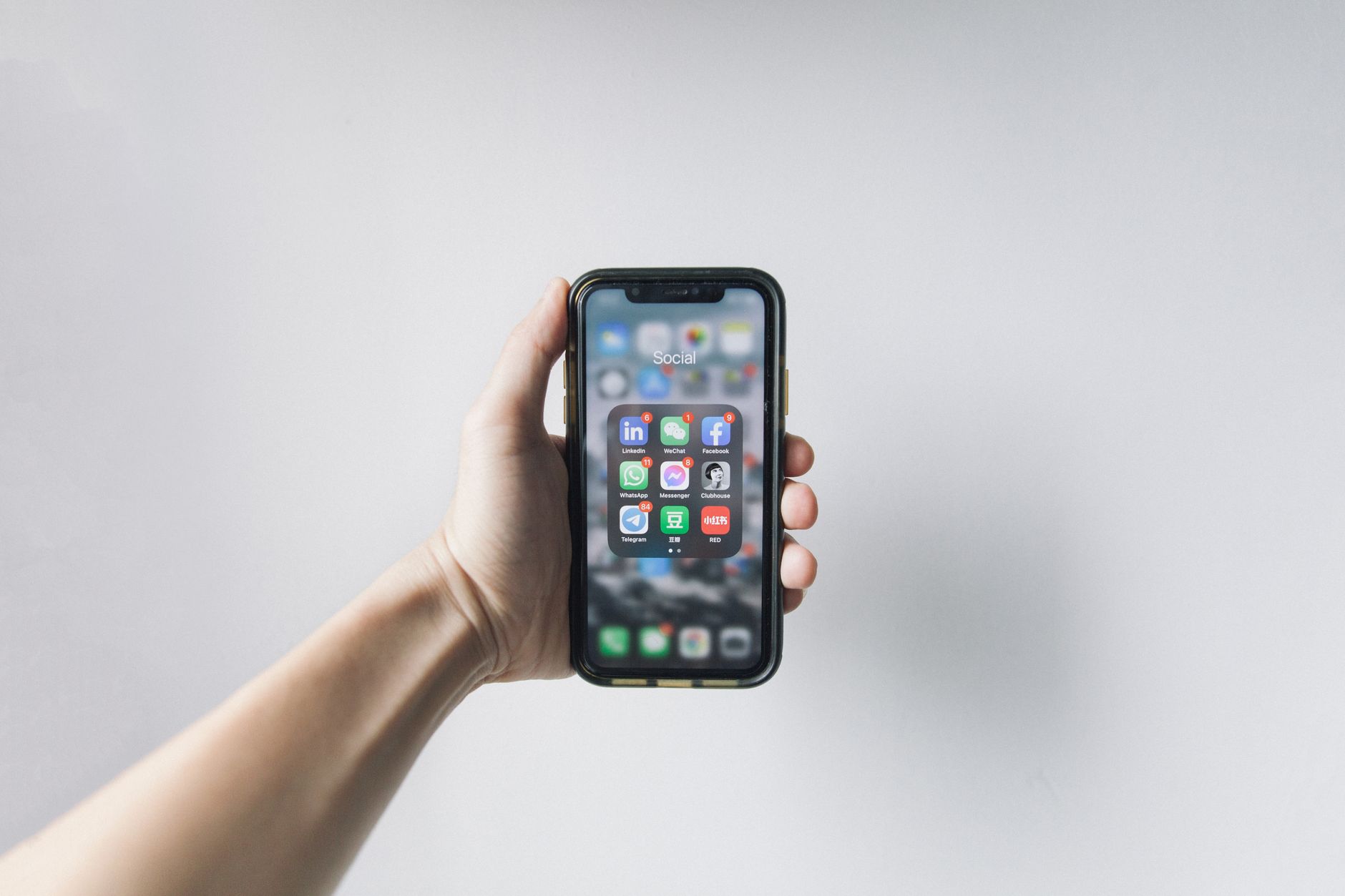 hand holding android phone with bright screen