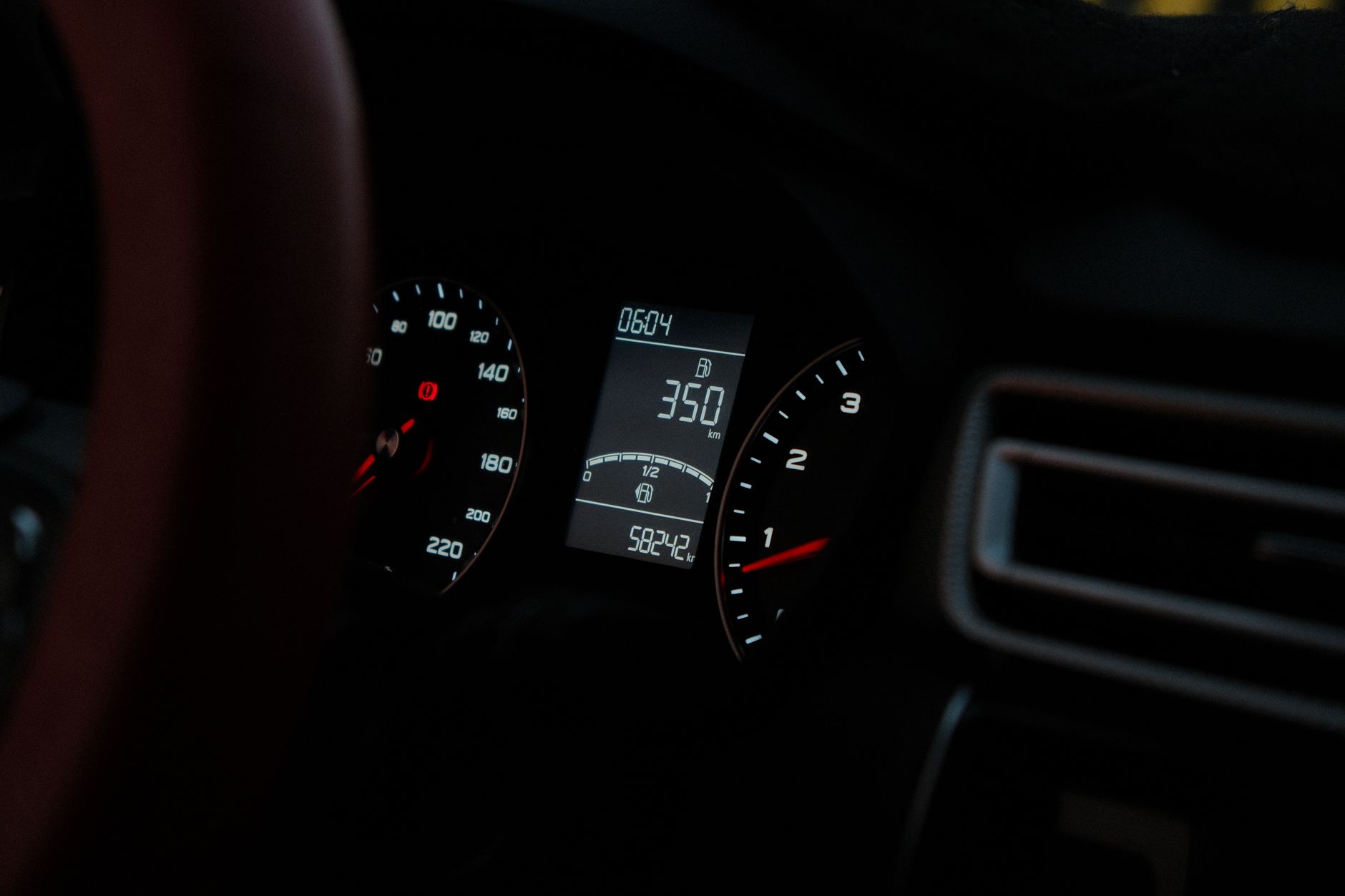 close-up of digital electricity meter display with green light