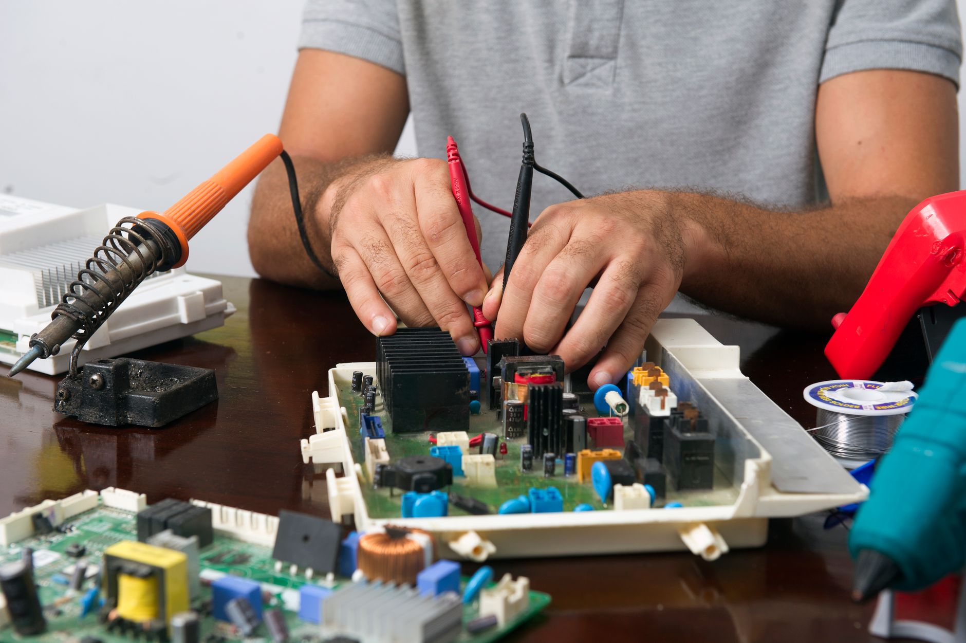 electrician hands holding digital electricity meter display