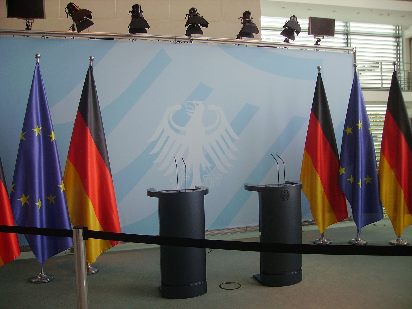 government official speaking at podium microphone