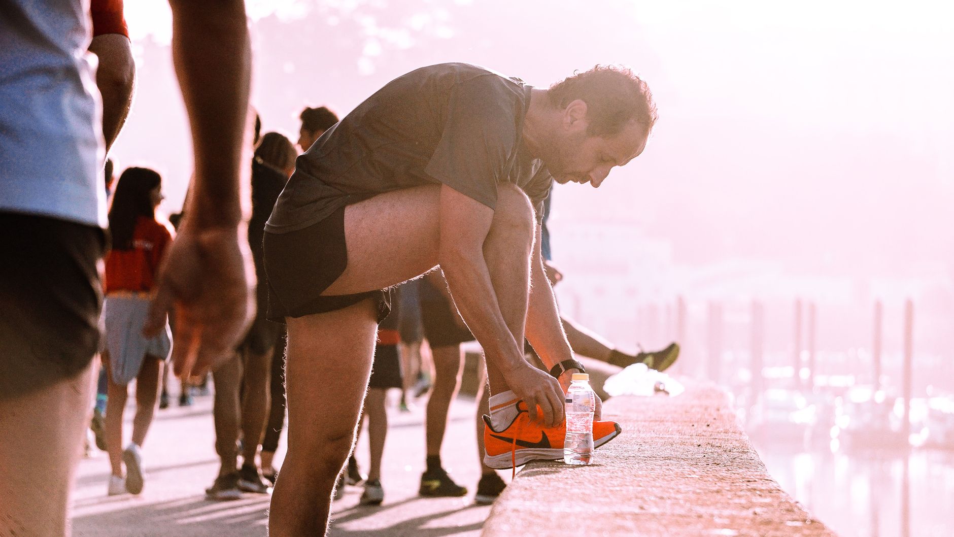 runner checking smartwatch after morning run