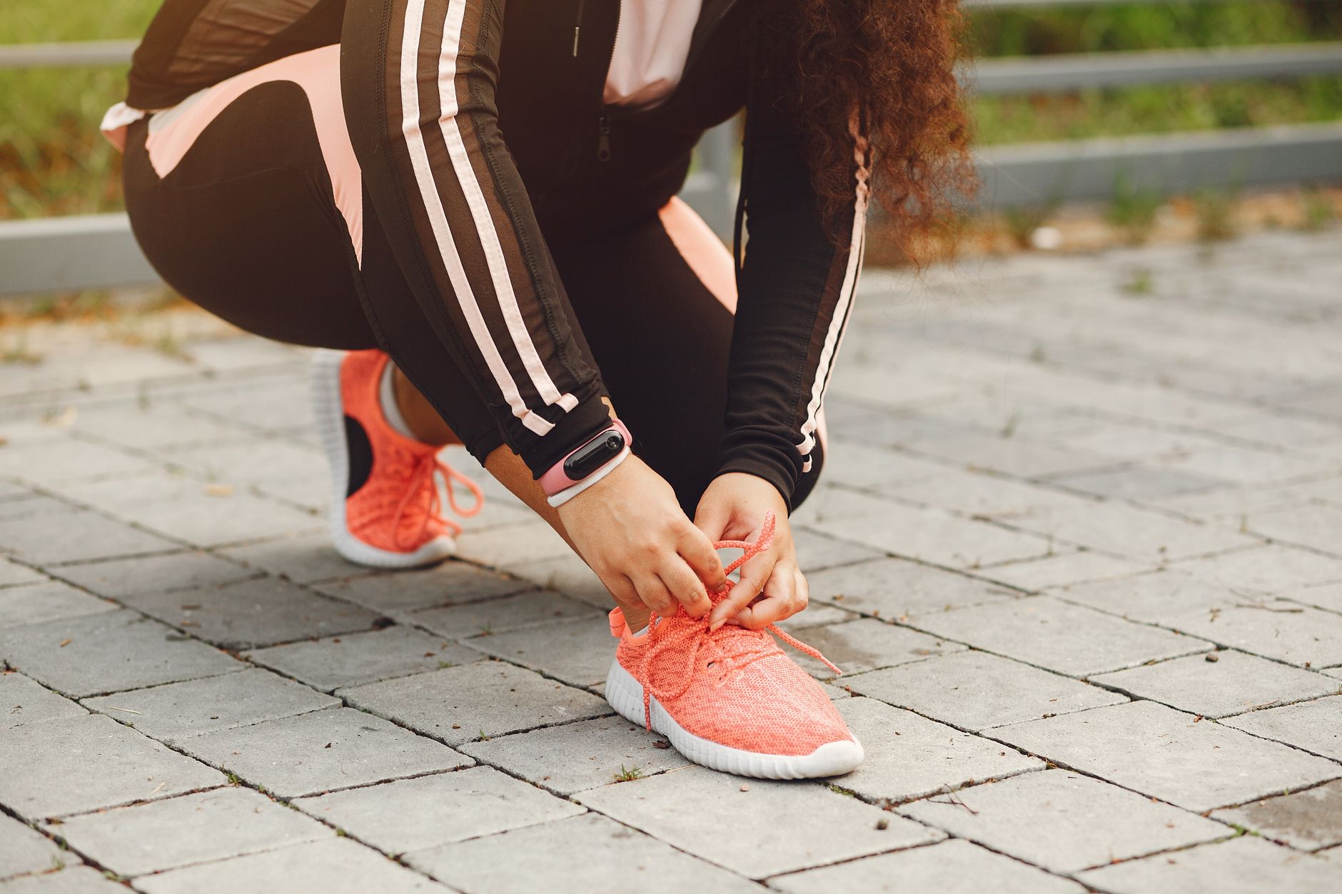 runner checking smartwatch after morning run