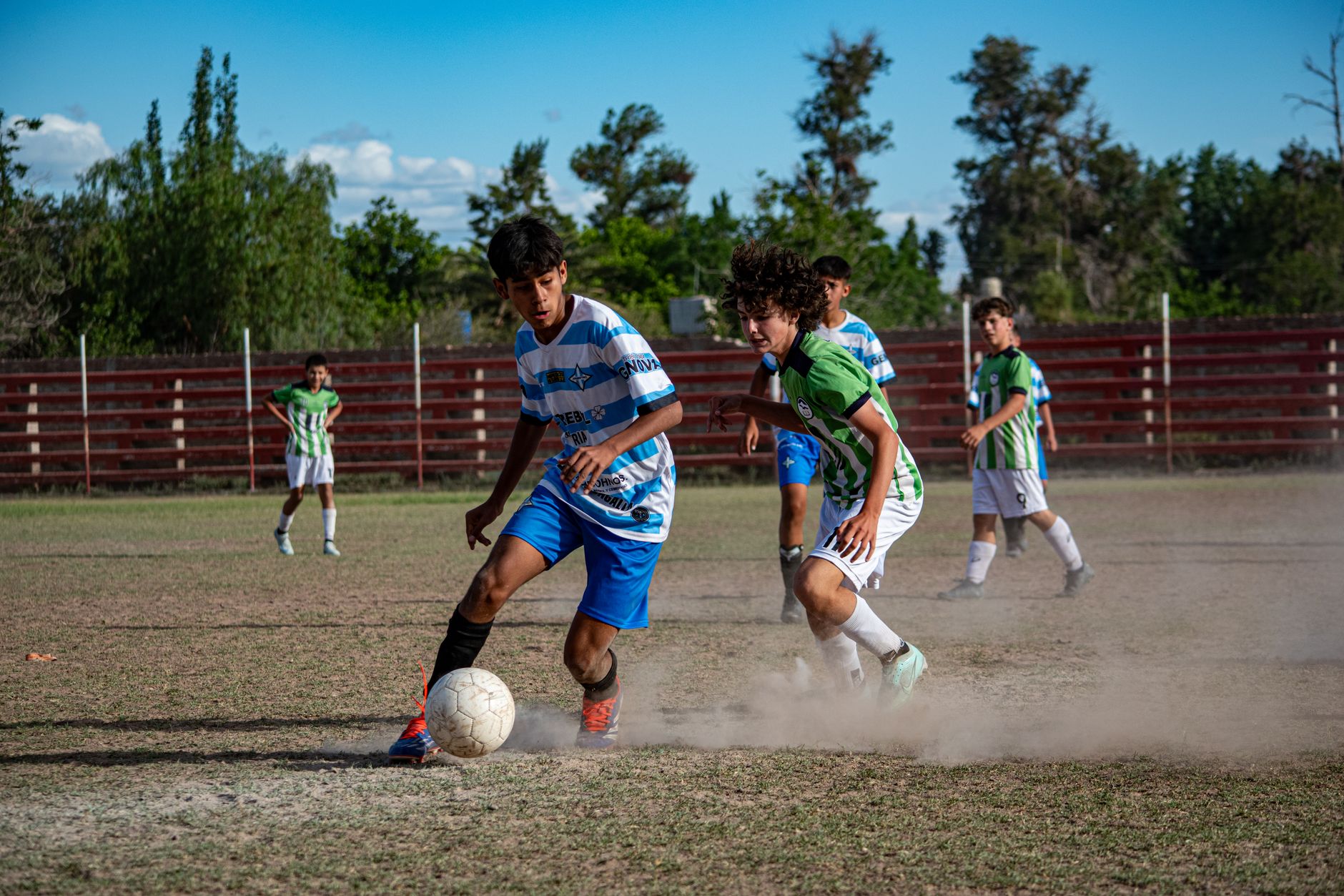 football players battling for possession on field